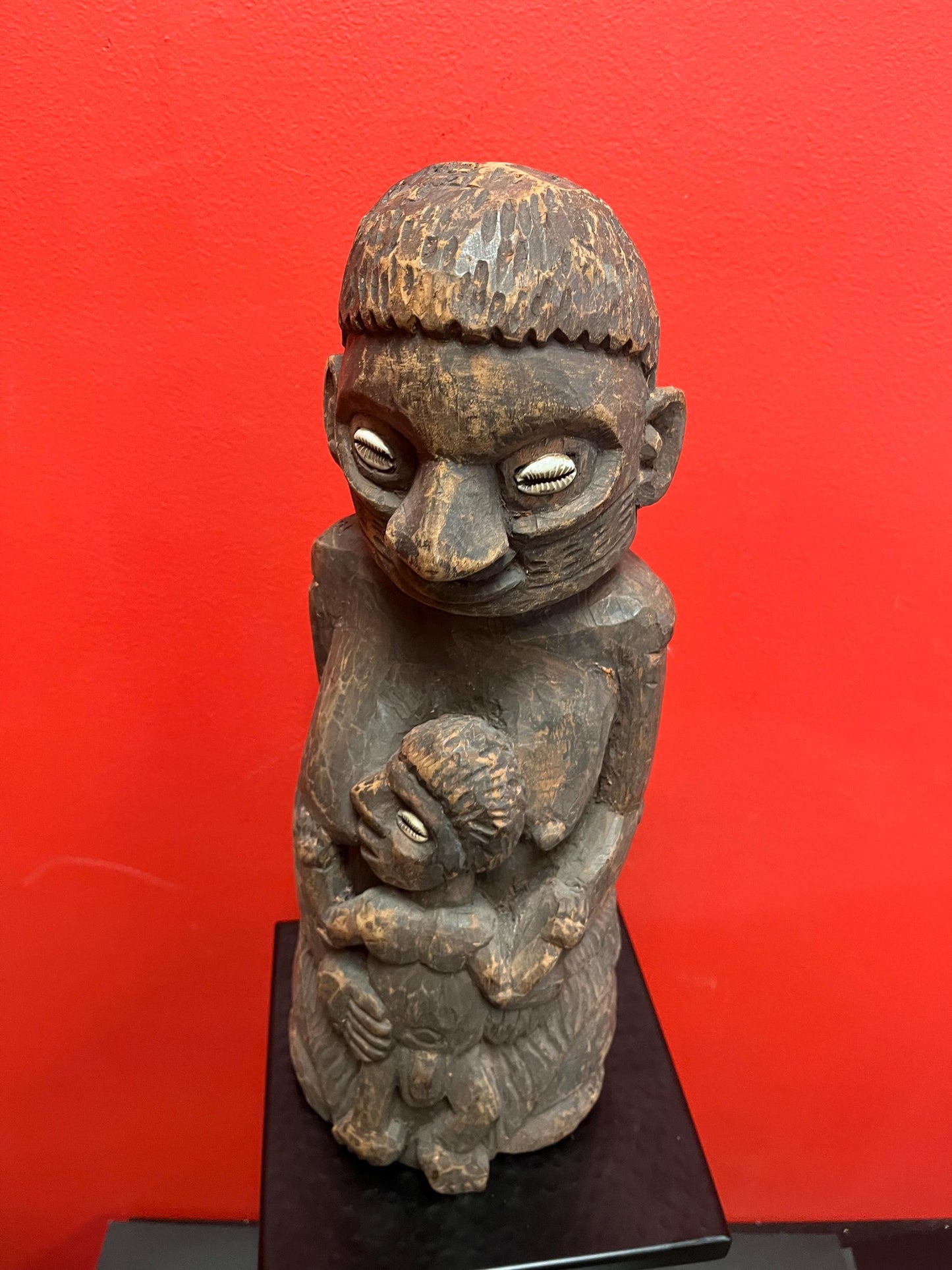 Super West African 16 inch wood statue of a mother feeding her son   shell eyes  amazing patina and imagery antique heavy African beauty