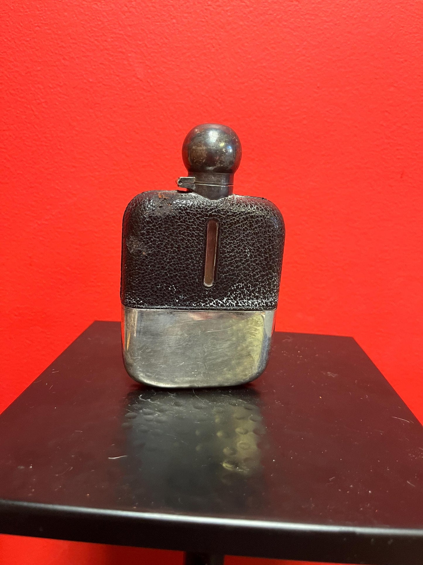 Handsome  5 inch tall leather and silver plated and glass antique English flask  good condition  needs a polish and great gift