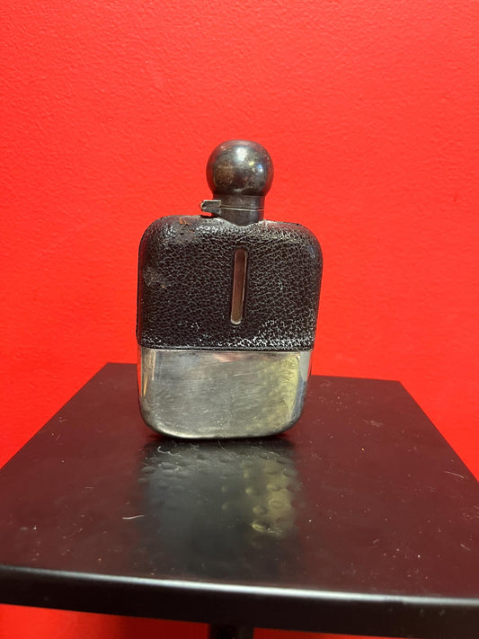 Handsome  5 inch tall leather and silver plated and glass antique English flask  good condition  needs a polish and great gift