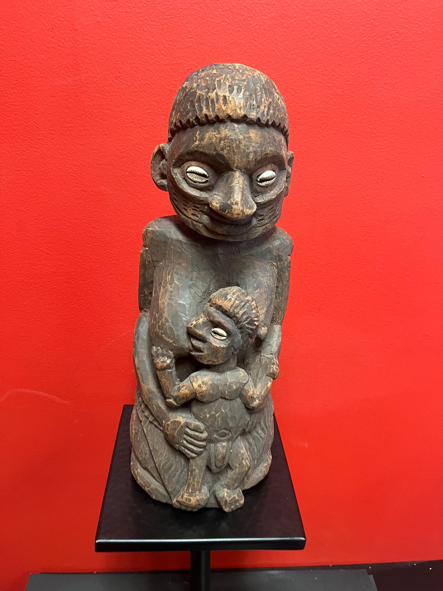 Super West African 16 inch wood statue of a mother feeding her son   shell eyes  amazing patina and imagery antique heavy African beauty