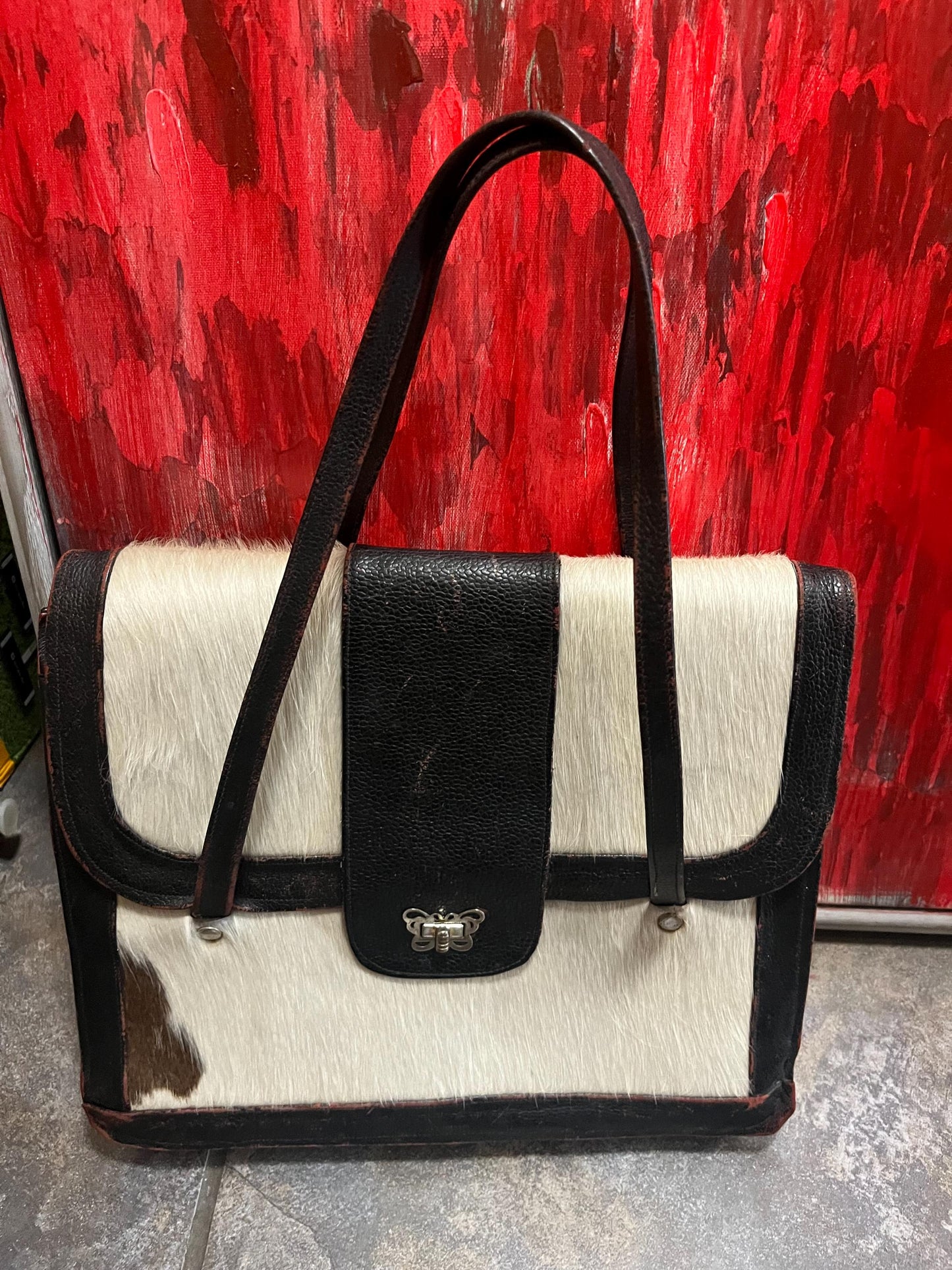 17 x 12 x 3 thick fabulous vintage cowhide and leather handbag with butterfly latch  great condition for age  great to use or gift  wow