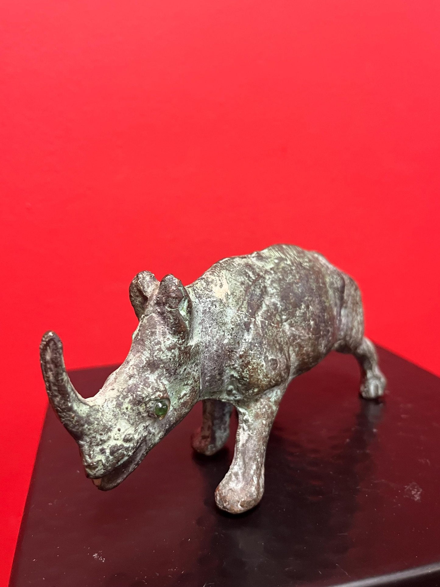 7 x 3 inch high antique Chinese bronze rhinoceros  great patina and amazing glass eyes  wow