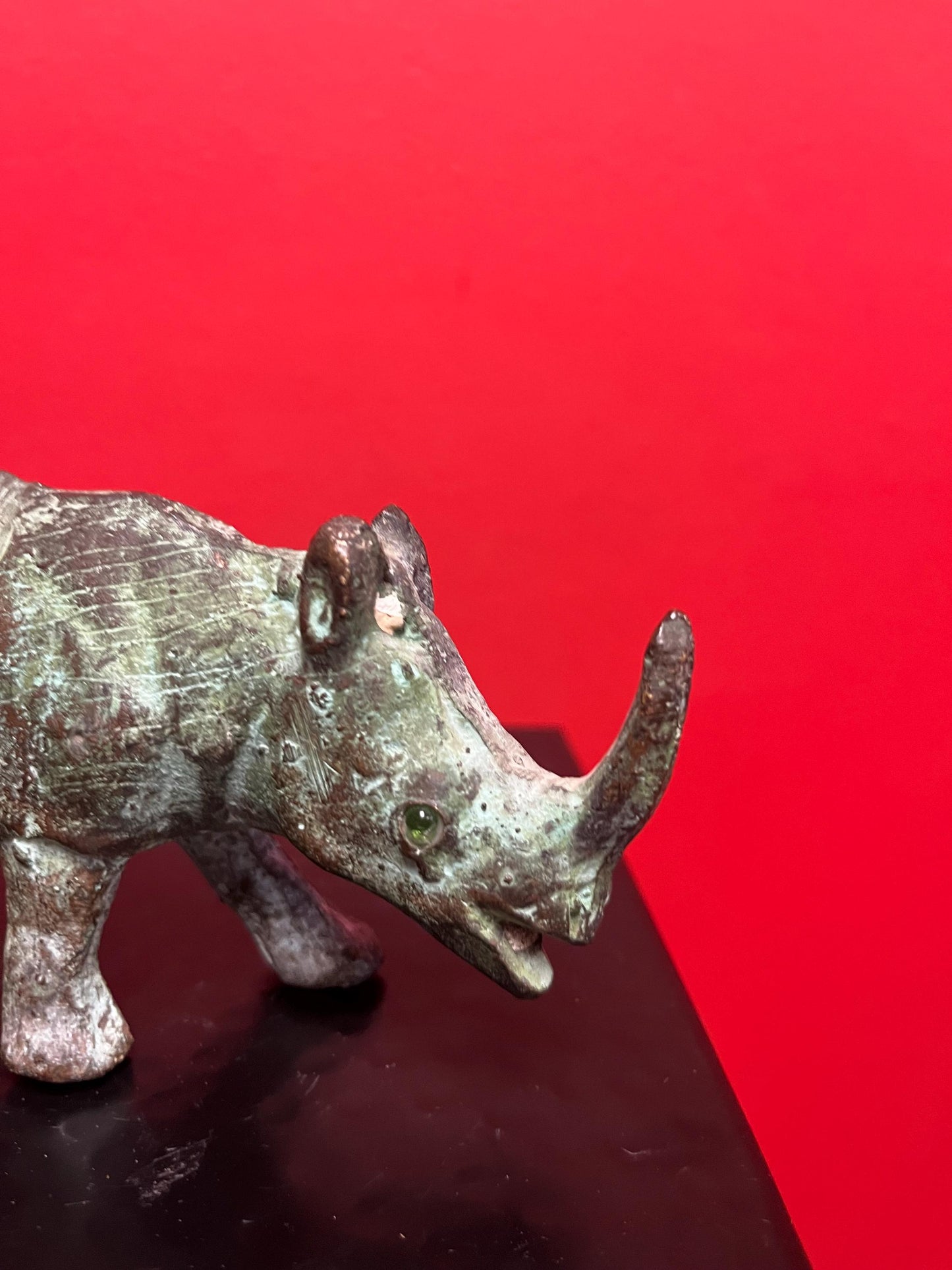 7 x 3 inch high antique Chinese bronze rhinoceros  great patina and amazing glass eyes  wow