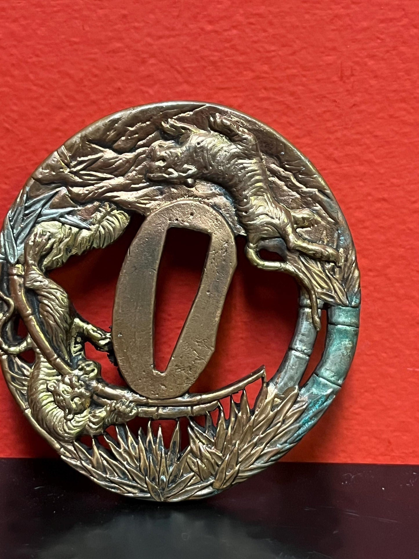 Lovely Japanese bronze signed  antique samurai  tsuba with good imagery from large collection  3 inches wide