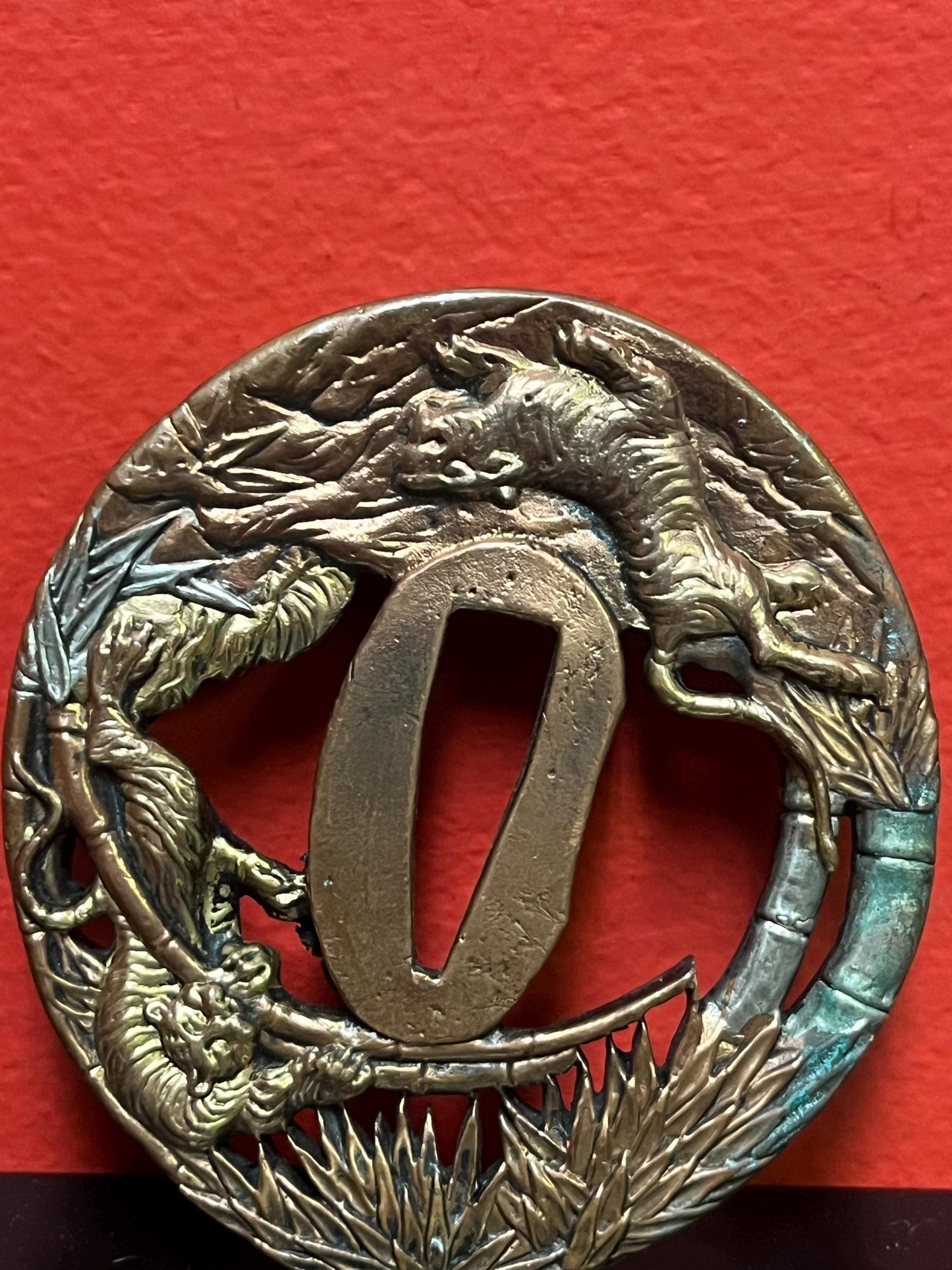 Lovely Japanese bronze signed  antique samurai  tsuba with good imagery from large collection  3 inches wide