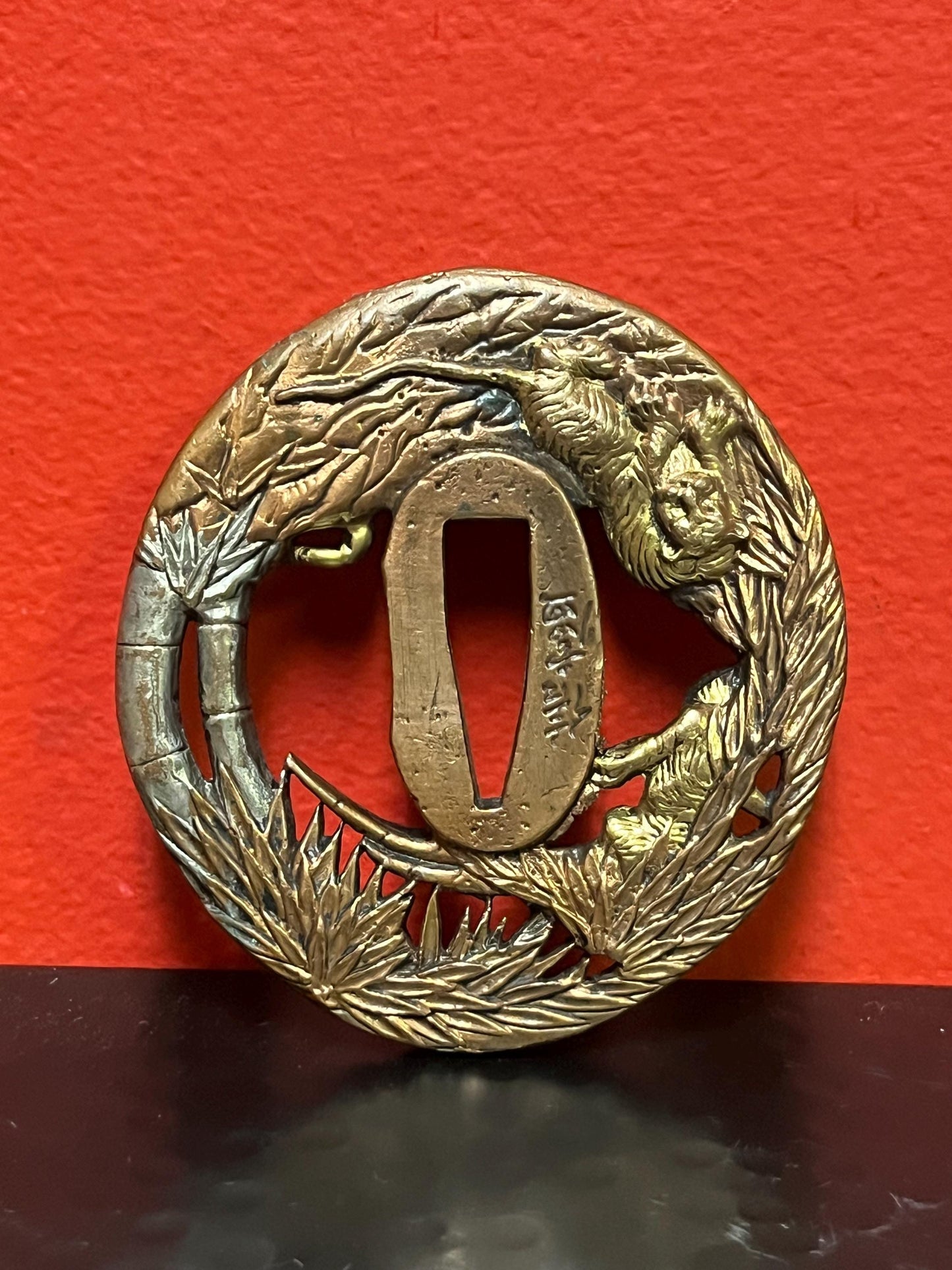 Lovely Japanese bronze signed  antique samurai  tsuba with good imagery from large collection  3 inches wide