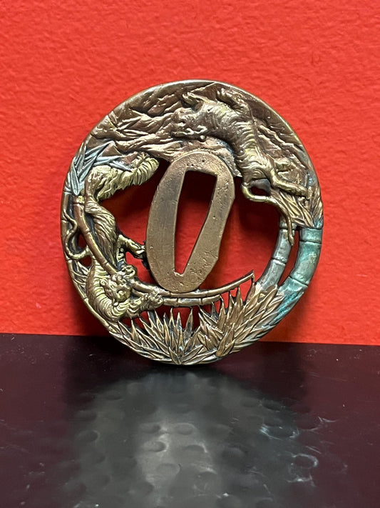 Lovely Japanese bronze signed  antique samurai  tsuba with good imagery from large collection  3 inches wide