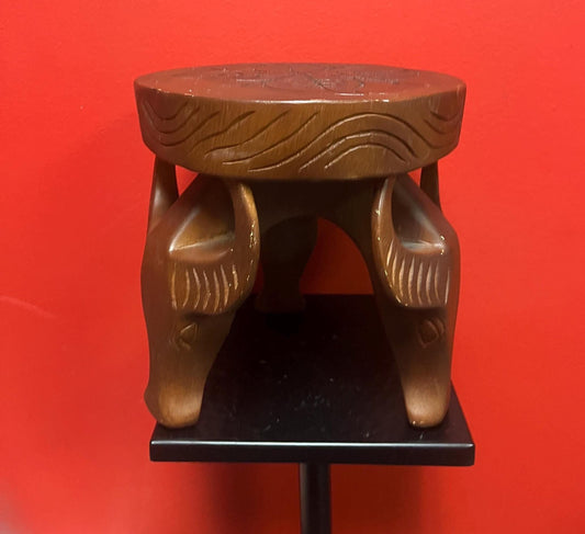 Very cool African 8 x 8” stool with legs the shape of yaks — great conversation piece and great value