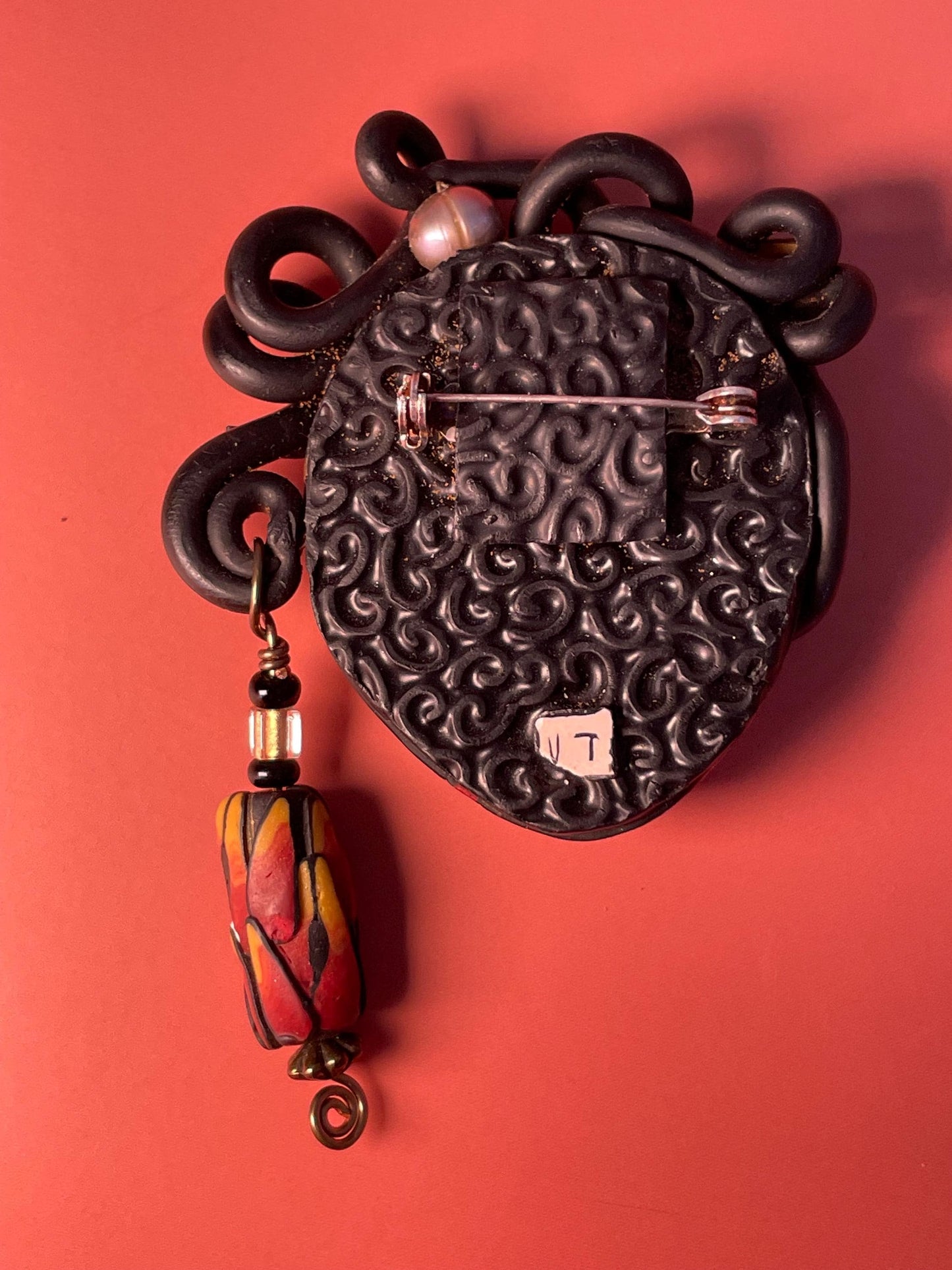 Polymer Clay Brooch  Womans Face with Curled Hair and Dangling Bead