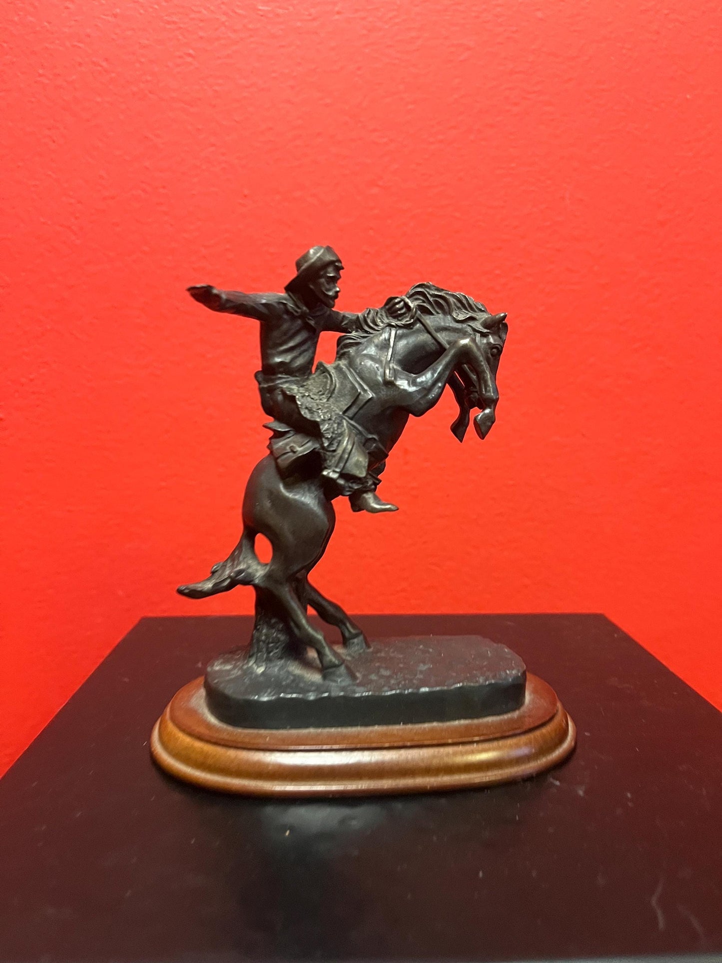 Lovely 5 inch high vintage Remington style bronze statue of a cowboy on horse on wood base great value and great gift