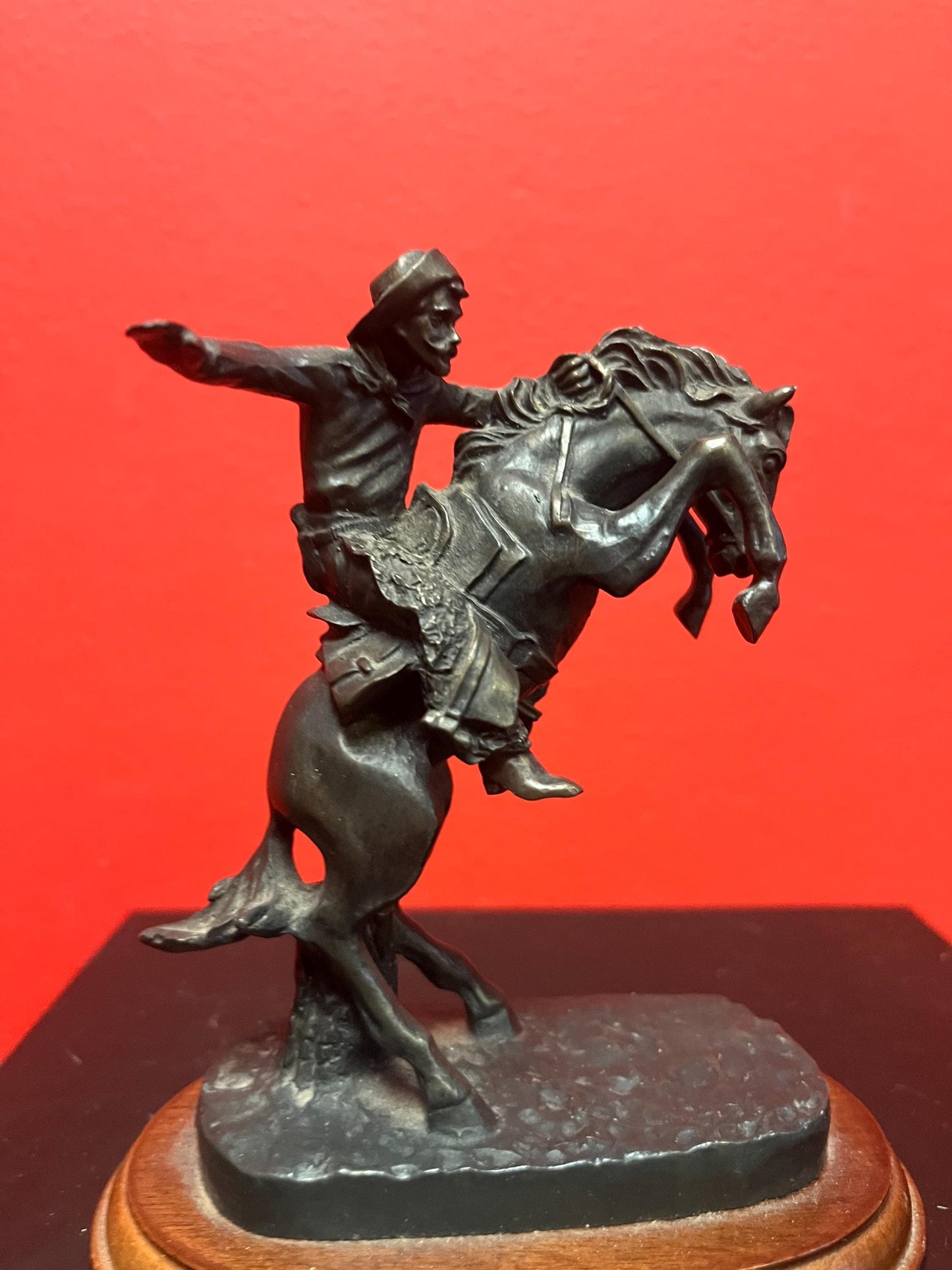 Lovely 5 inch high vintage Remington style bronze statue of a cowboy on horse on wood base great value and great gift