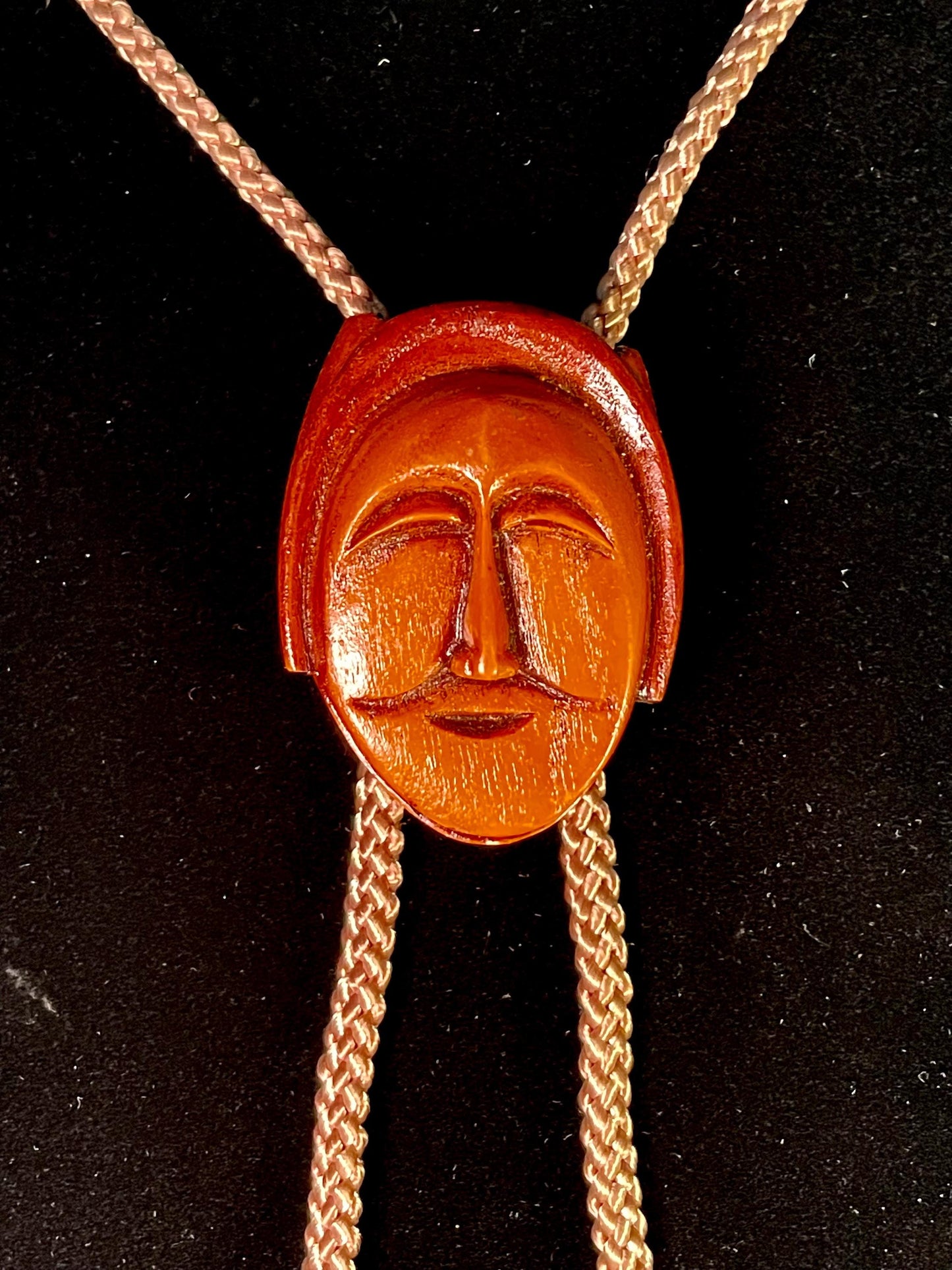 38 Bolo Tie with Carved Face and Accent Beads