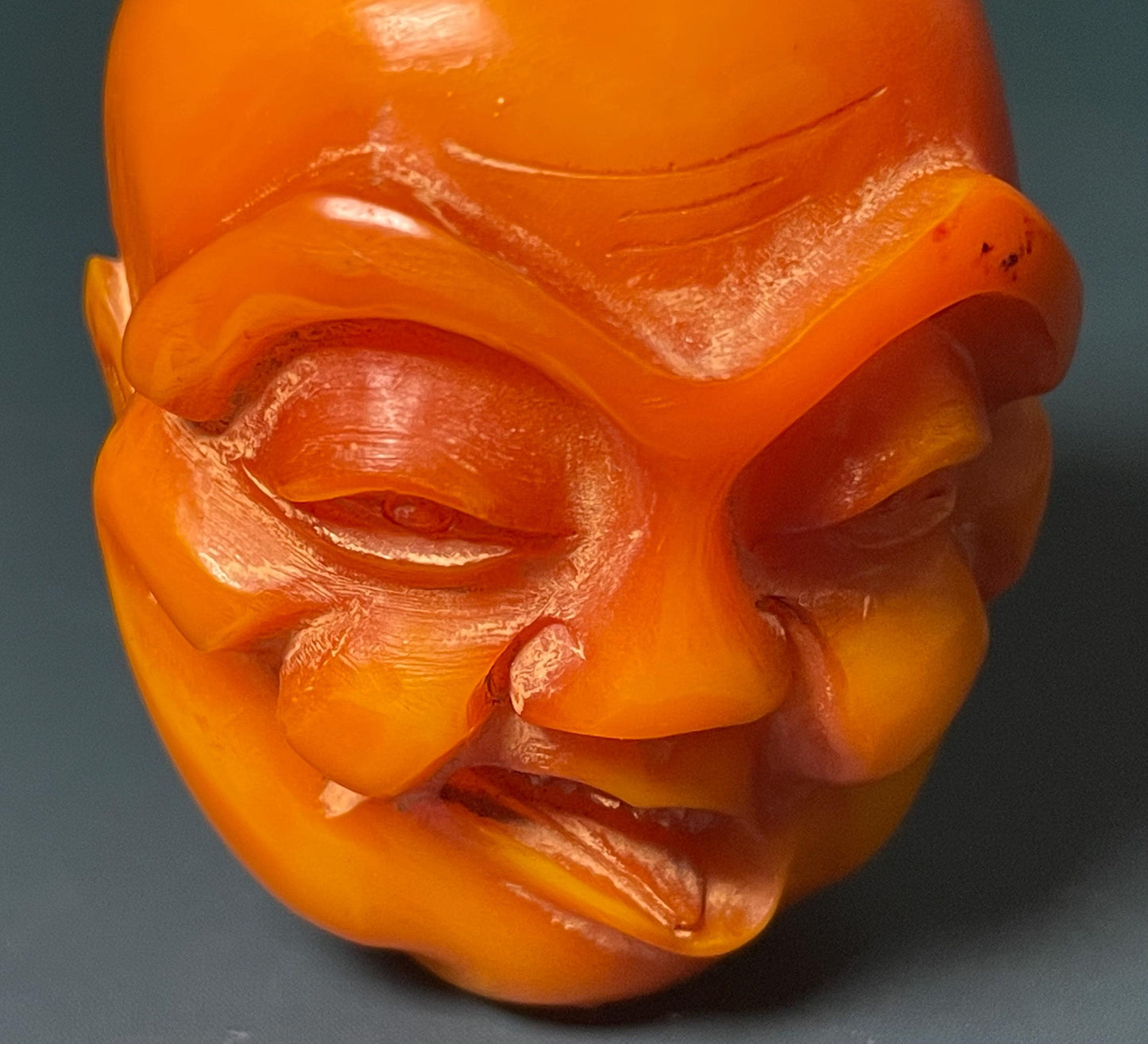 Amber Carved Arhat Head 2 inches high, Intricate Buddhist Art