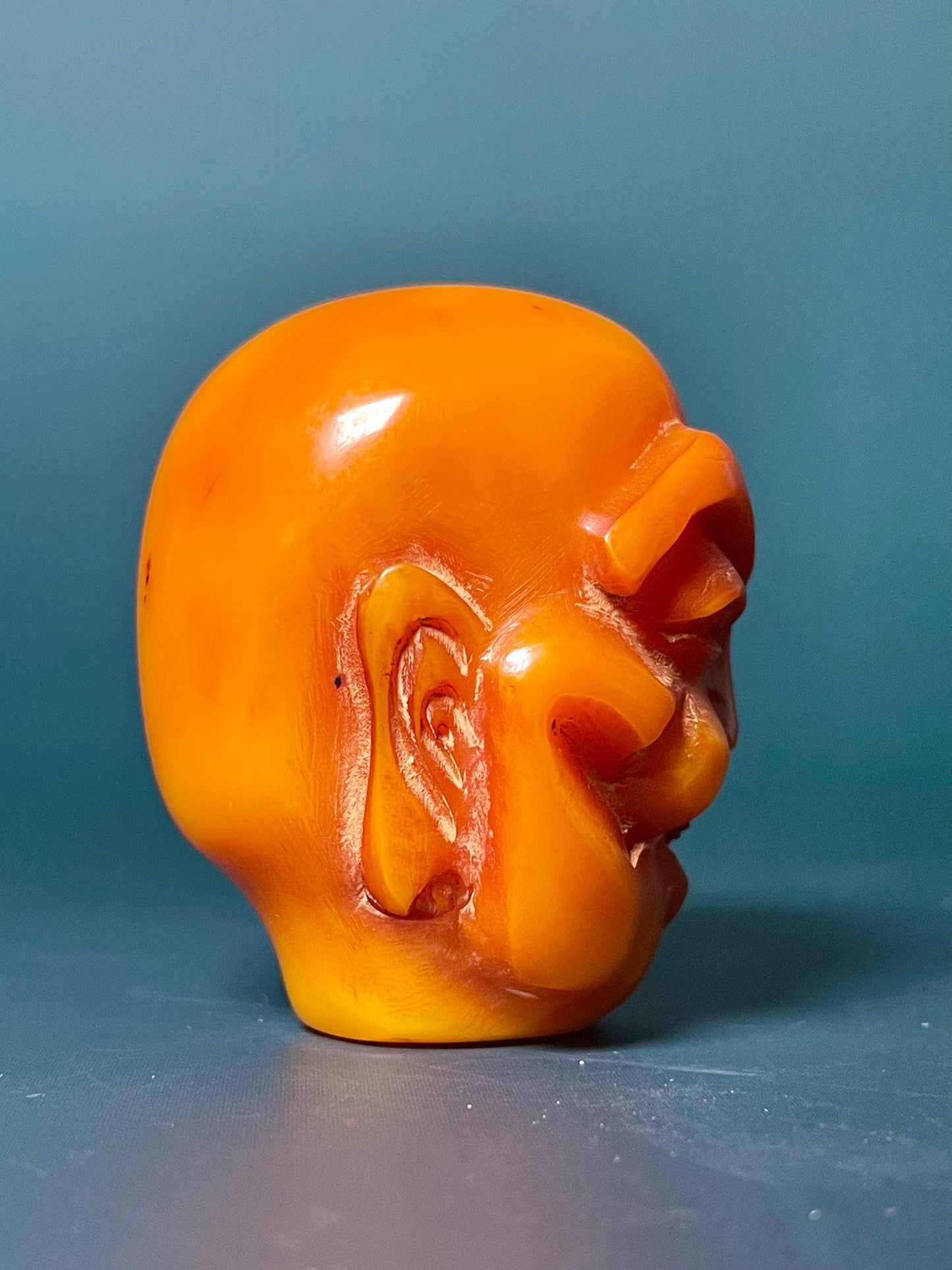 Amber Carved Arhat Head 2 inches high, Intricate Buddhist Art