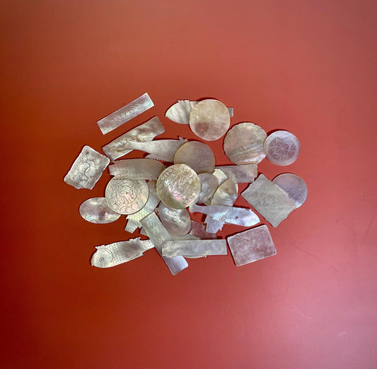 Assorted lot of mother of pearl chips. Approx 1.5 inches
