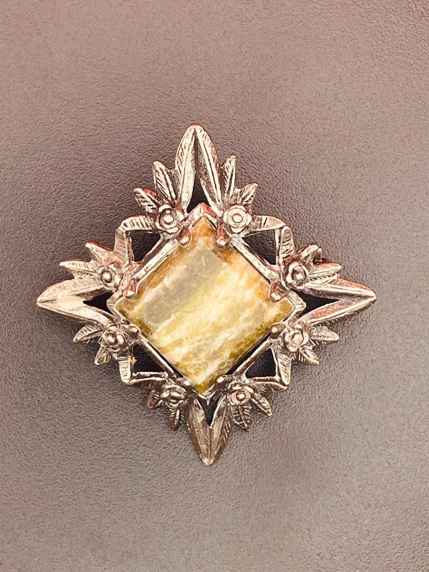 Gorgeous silver brooch with central stone