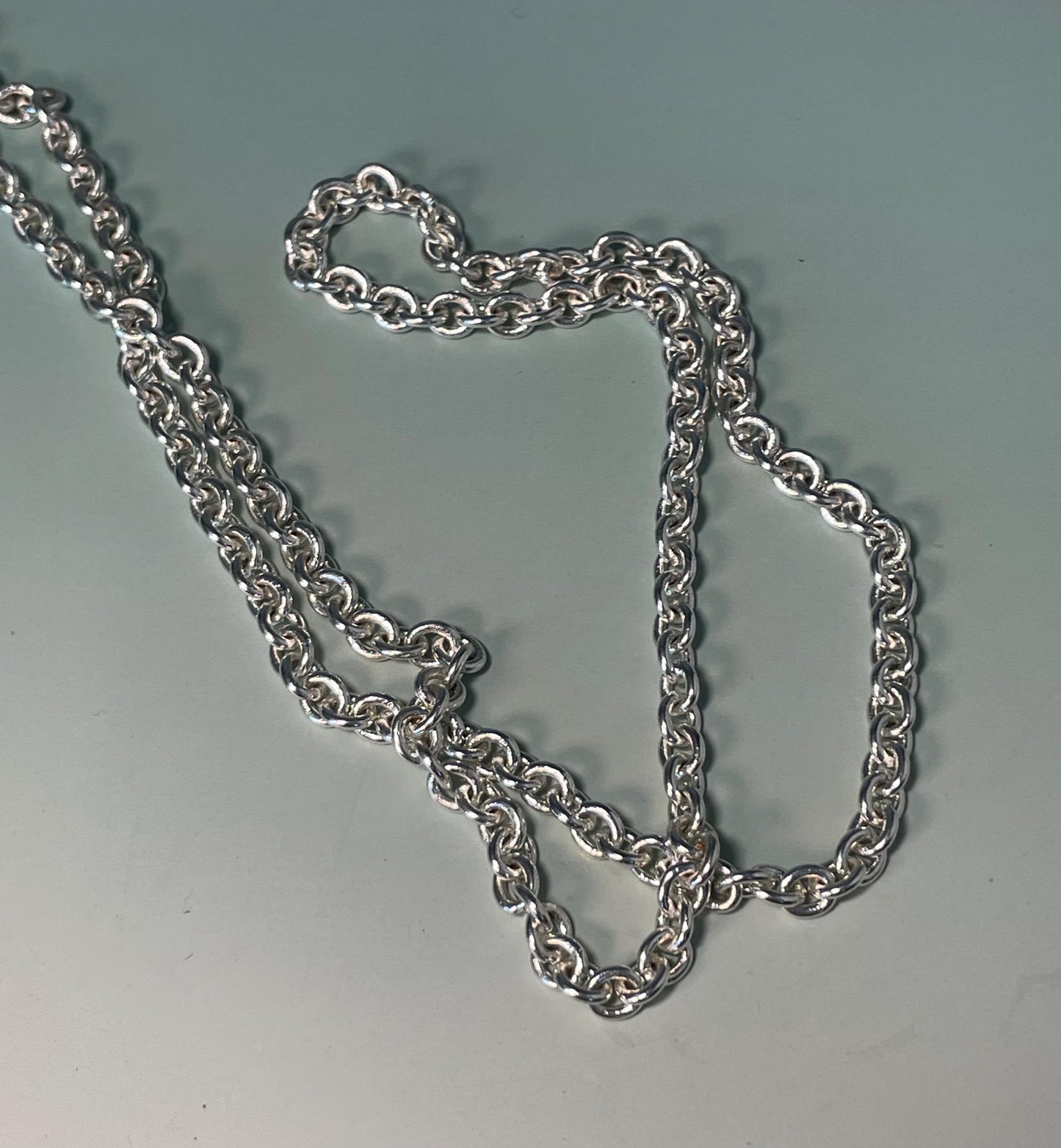 Lot of 2 Necklaces  Red Beaded 24 inch with 4.5 inch Pendant & Silver Leaf 32 inch with 4 inch Pendant