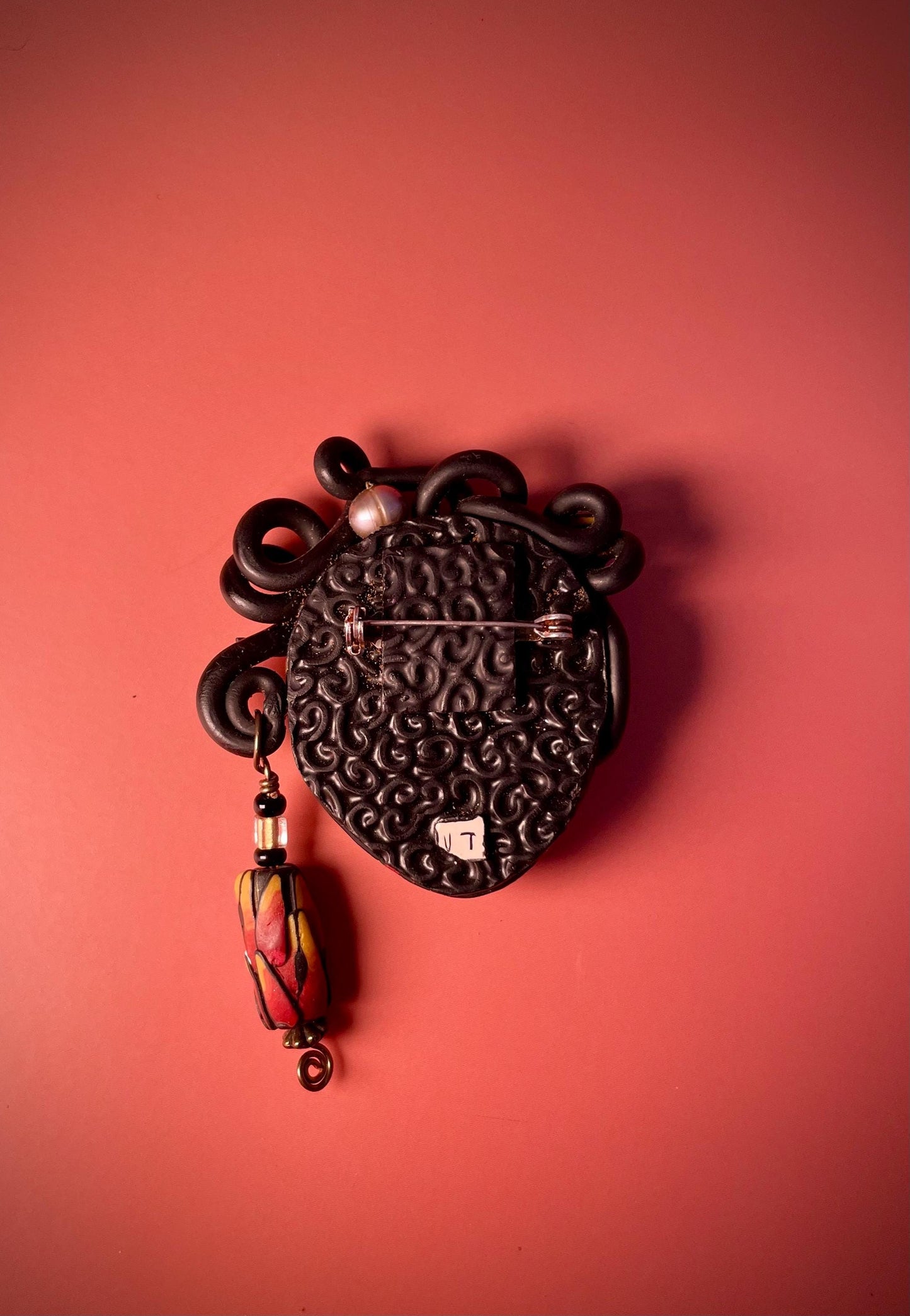 Polymer Clay Brooch  Womans Face with Curled Hair and Dangling Bead