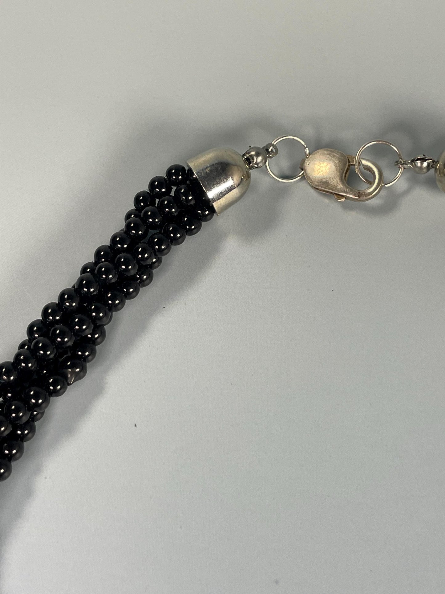 Black Beaded Necklace With Metal Pendant