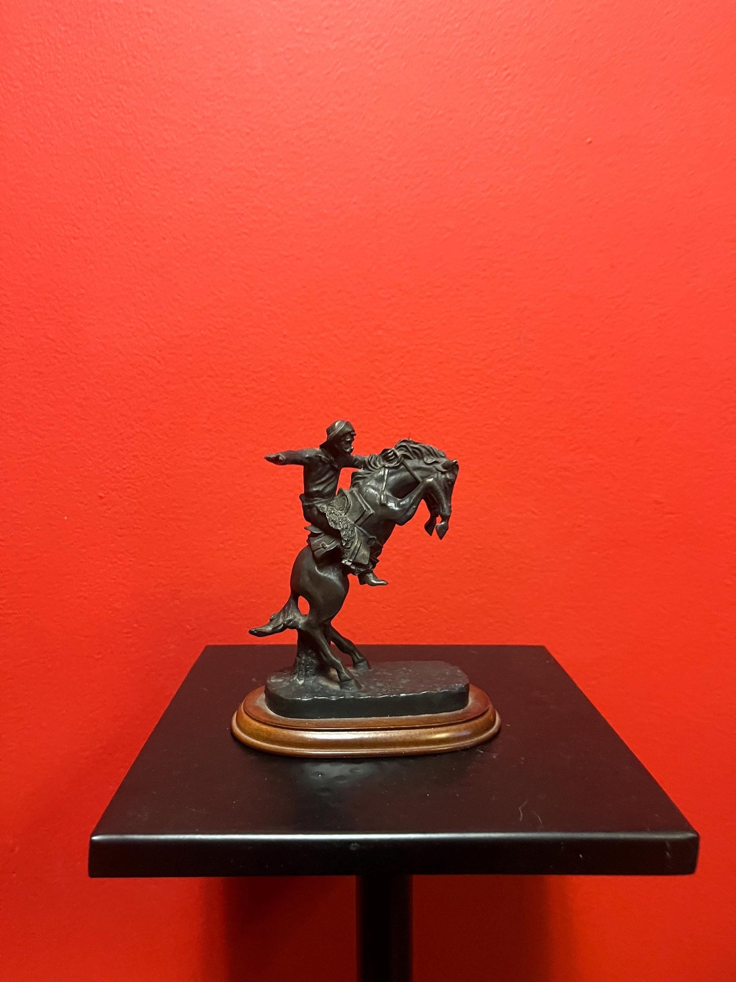 Lovely 5 inch high vintage Remington style bronze statue of a cowboy on horse on wood base great value and great gift