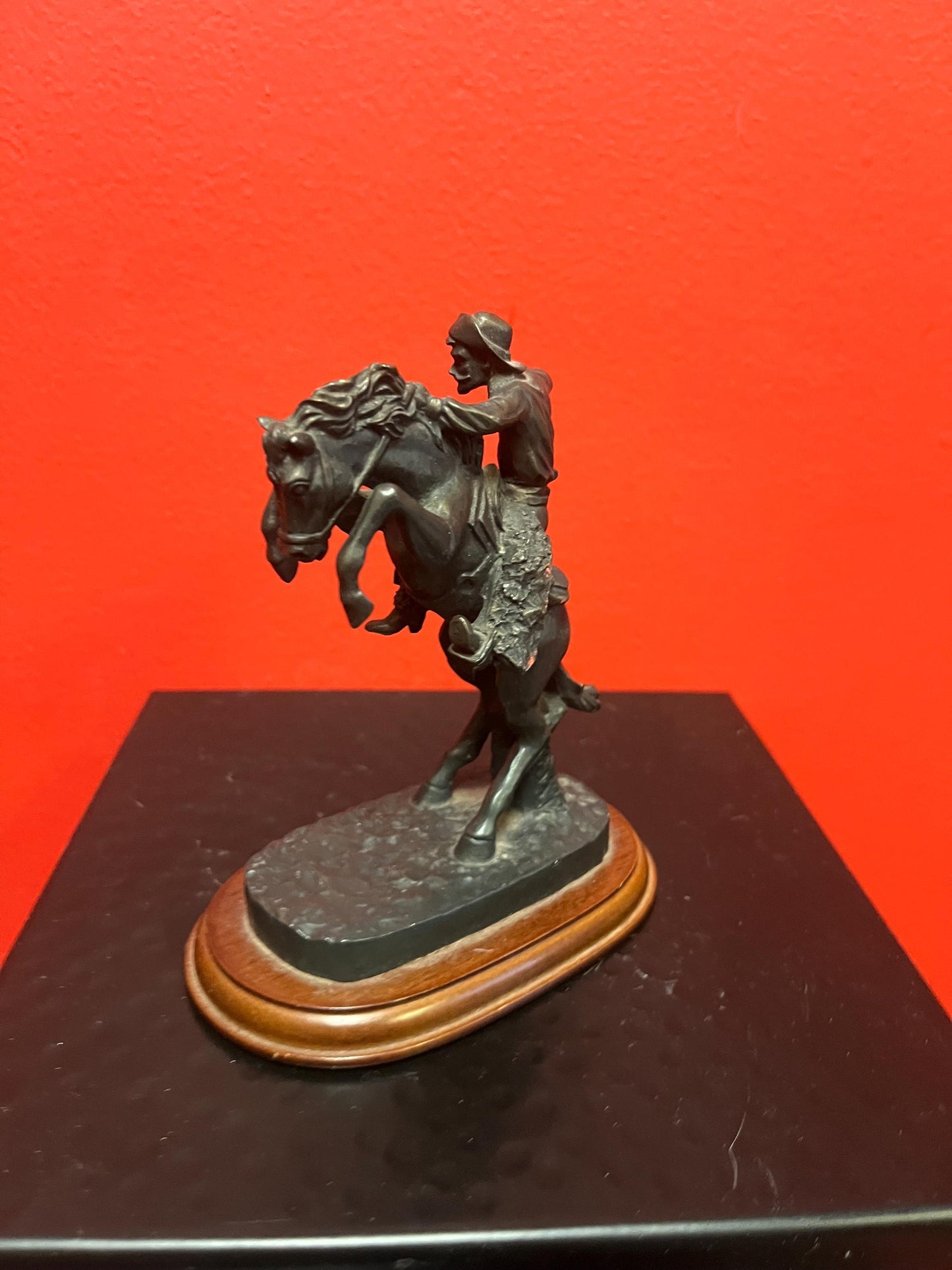 Lovely 5 inch high vintage Remington style bronze statue of a cowboy on horse on wood base great value and great gift