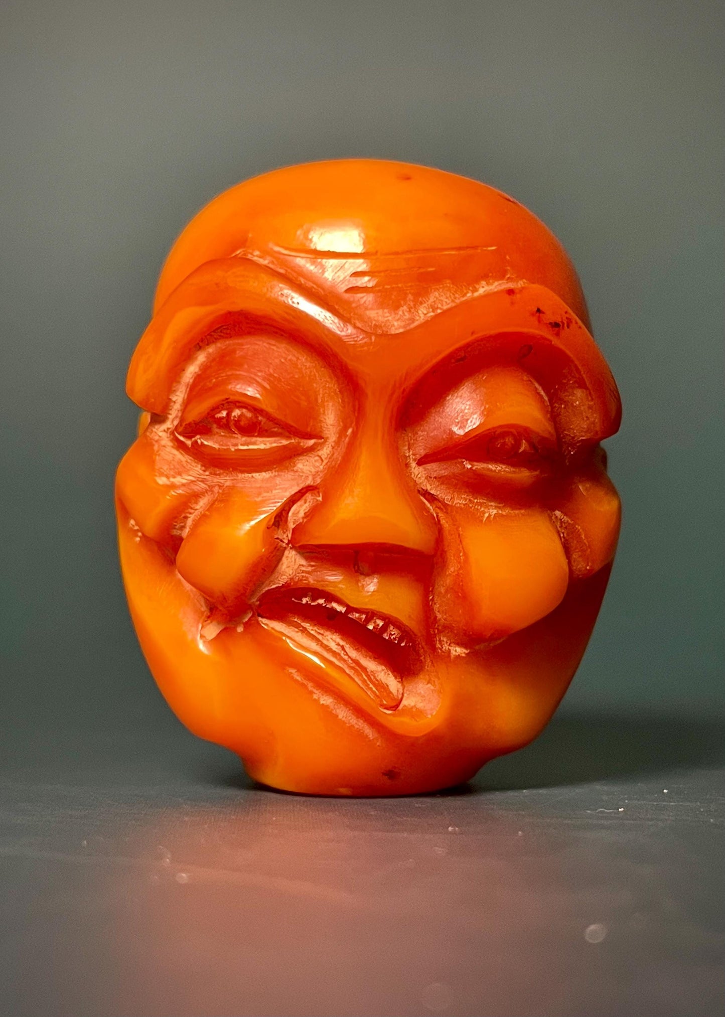 Amber Carved Arhat Head 2 inches high, Intricate Buddhist Art