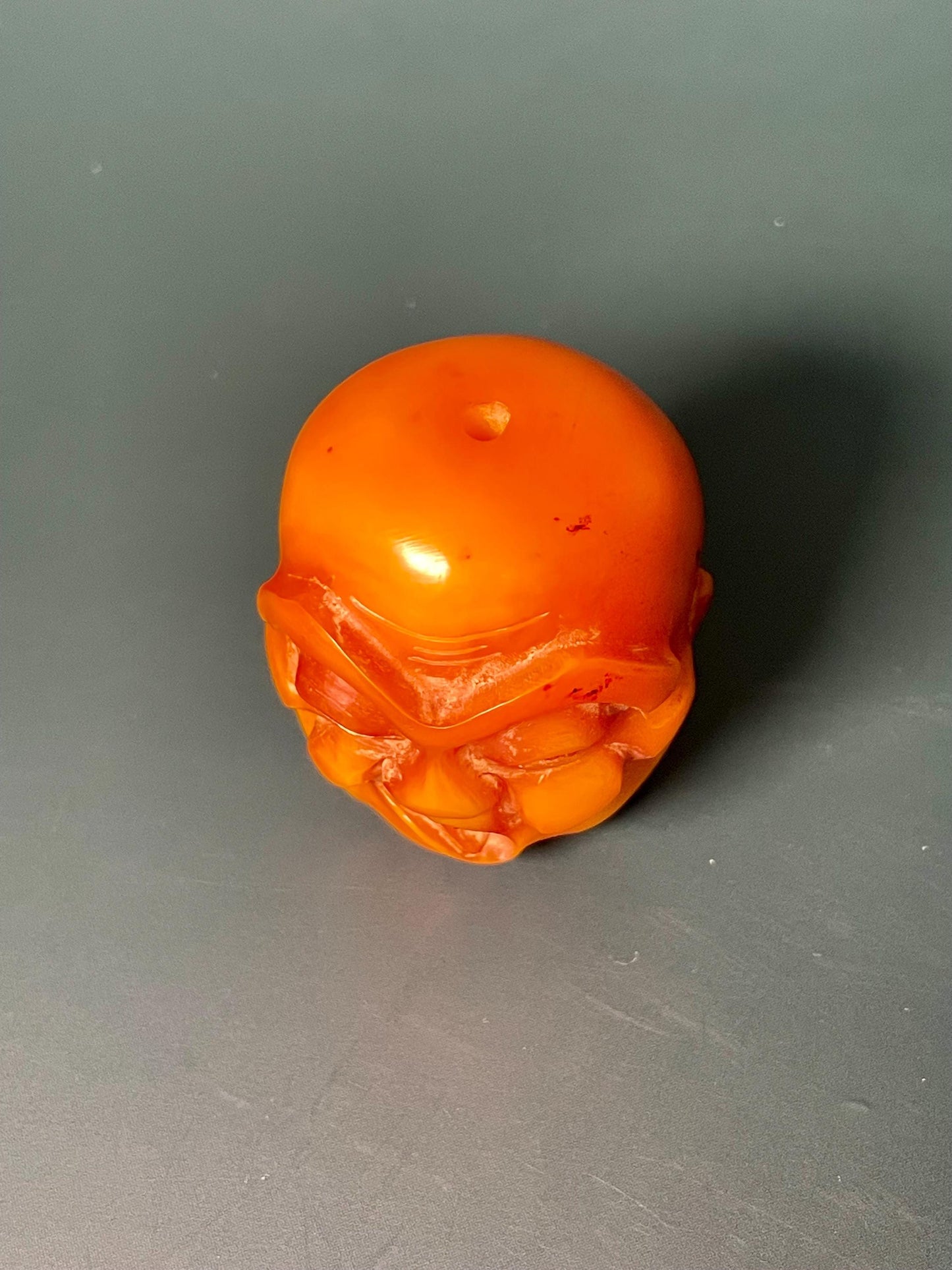 Amber Carved Arhat Head 2 inches high, Intricate Buddhist Art