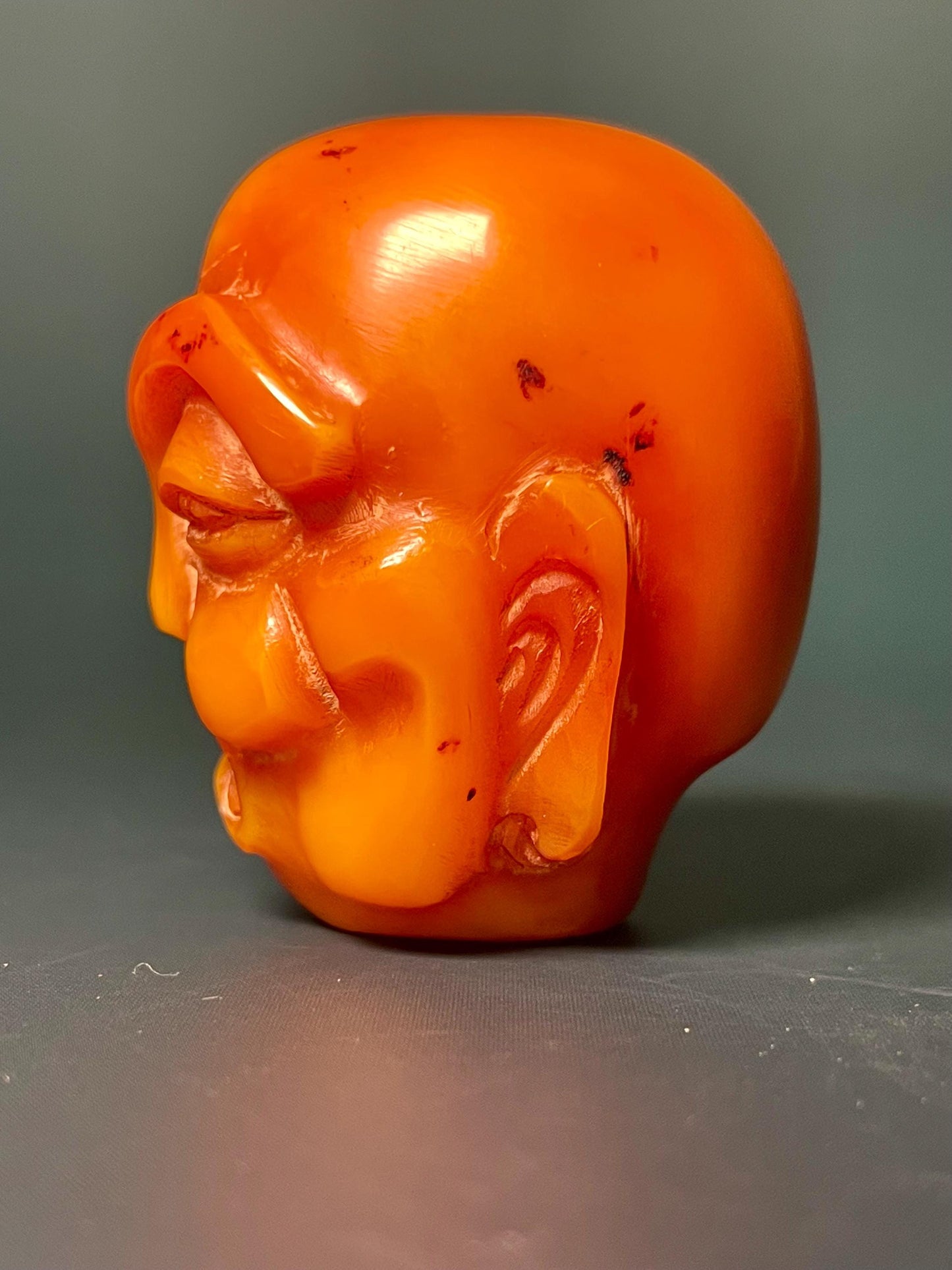 Amber Carved Arhat Head 2 inches high, Intricate Buddhist Art