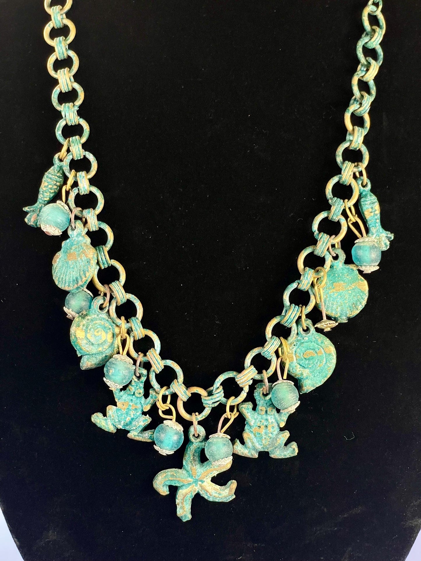 Lovely ocean themed bronze necklace - approximately 25 inches long  very unusual and cool