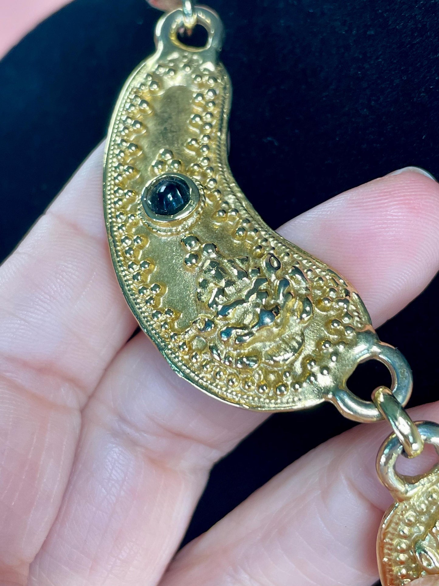 Gold-Tone Collar Necklace with Textured Details & Black Stone Accents