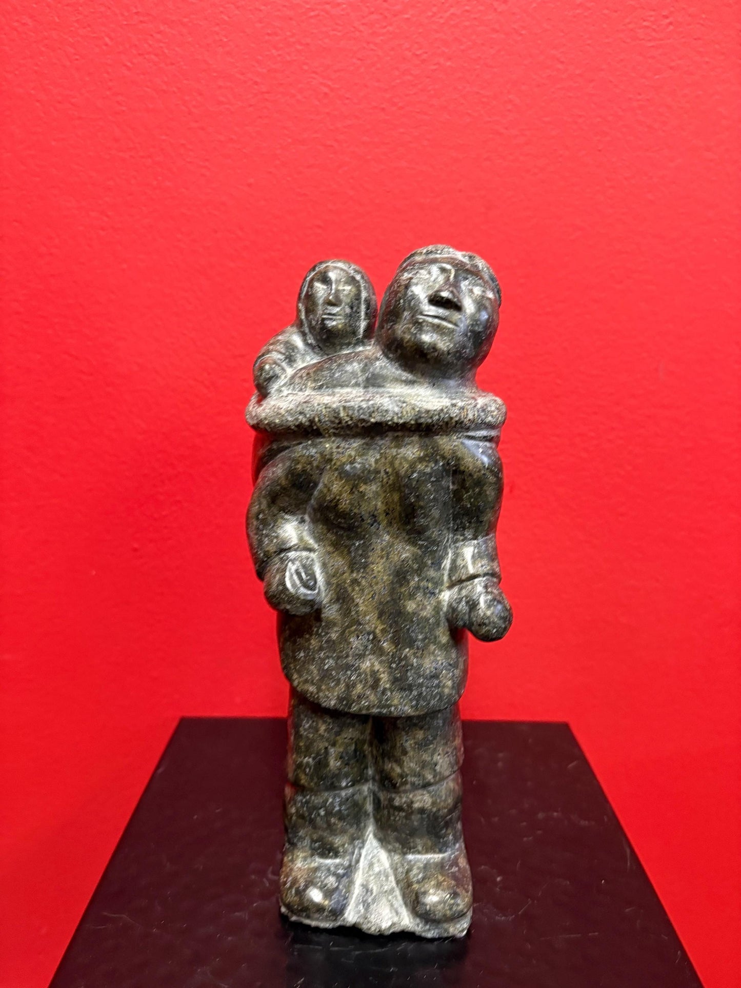 Fabulous signed indigenous Inuit  soapstone statue of a man and child   9 inches tall  great condition and detail  Inuit art