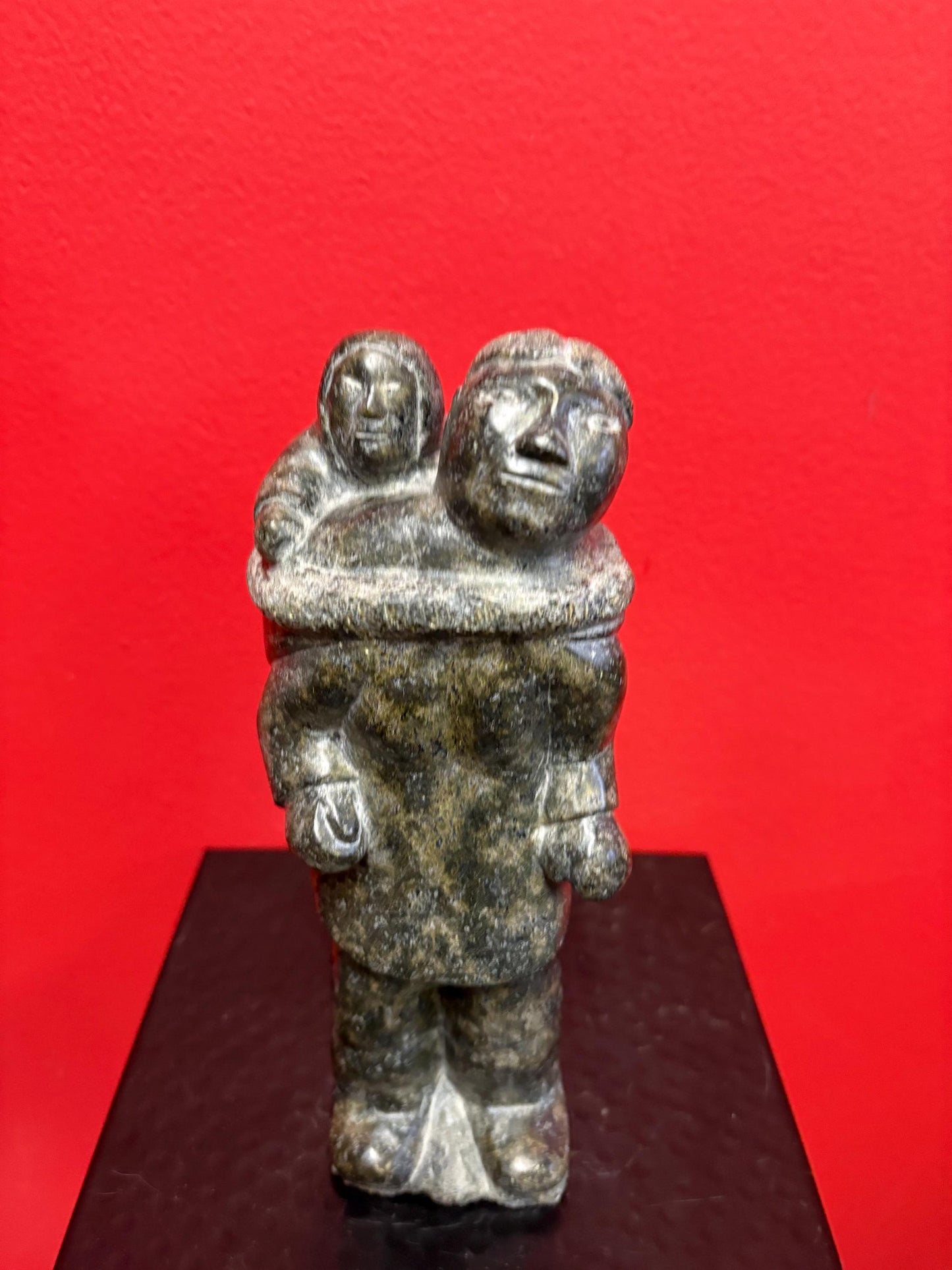 Fabulous signed indigenous Inuit  soapstone statue of a man and child   9 inches tall  great condition and detail  Inuit art