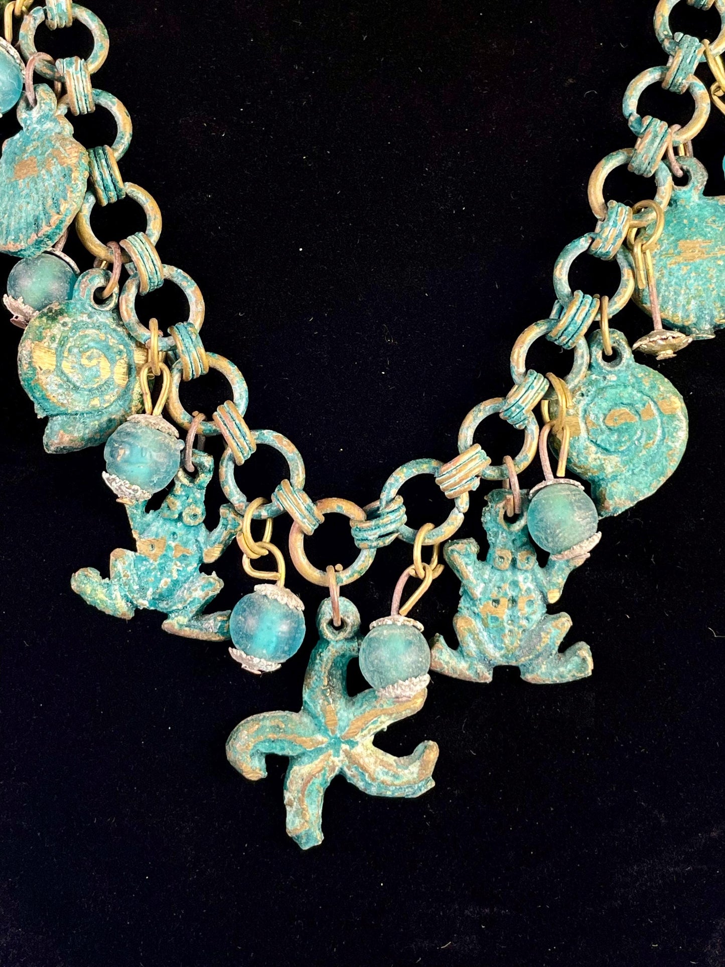 Lovely ocean themed bronze necklace - approximately 25 inches long  very unusual and cool