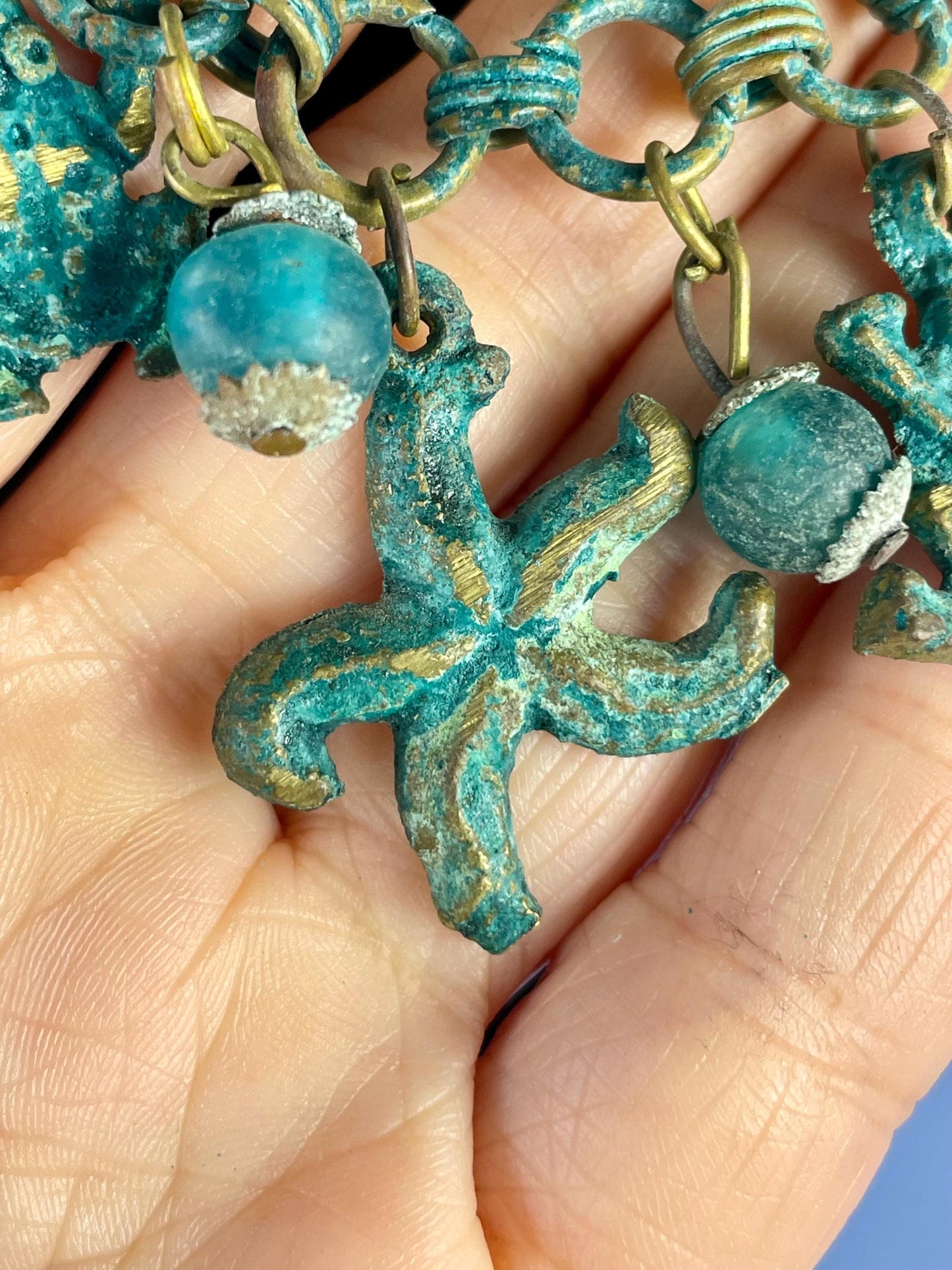 Lovely ocean themed bronze necklace - approximately 25 inches long  very unusual and cool