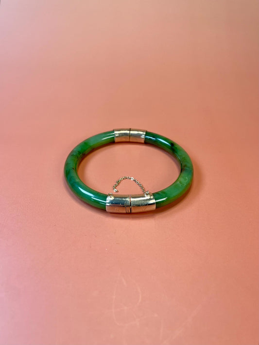 Lovely jade and gold toned bangle  value priced  2.5 inches inside