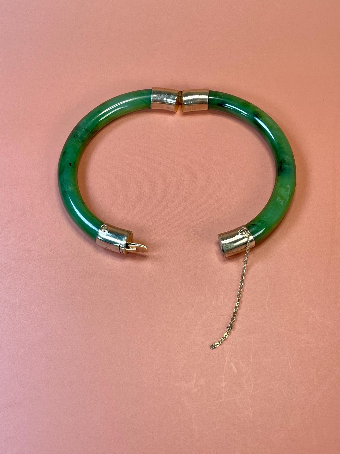 Lovely jade and gold toned bangle  value priced  2.5 inches inside
