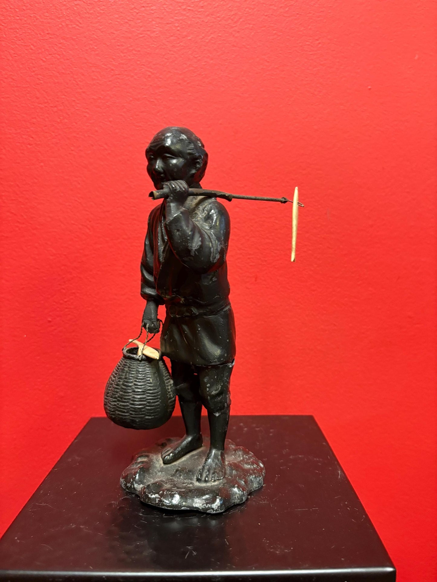 Antique Japanese bronze fisherman with bone fish  8.5 inches tall  see photos  lovely piece  great gift