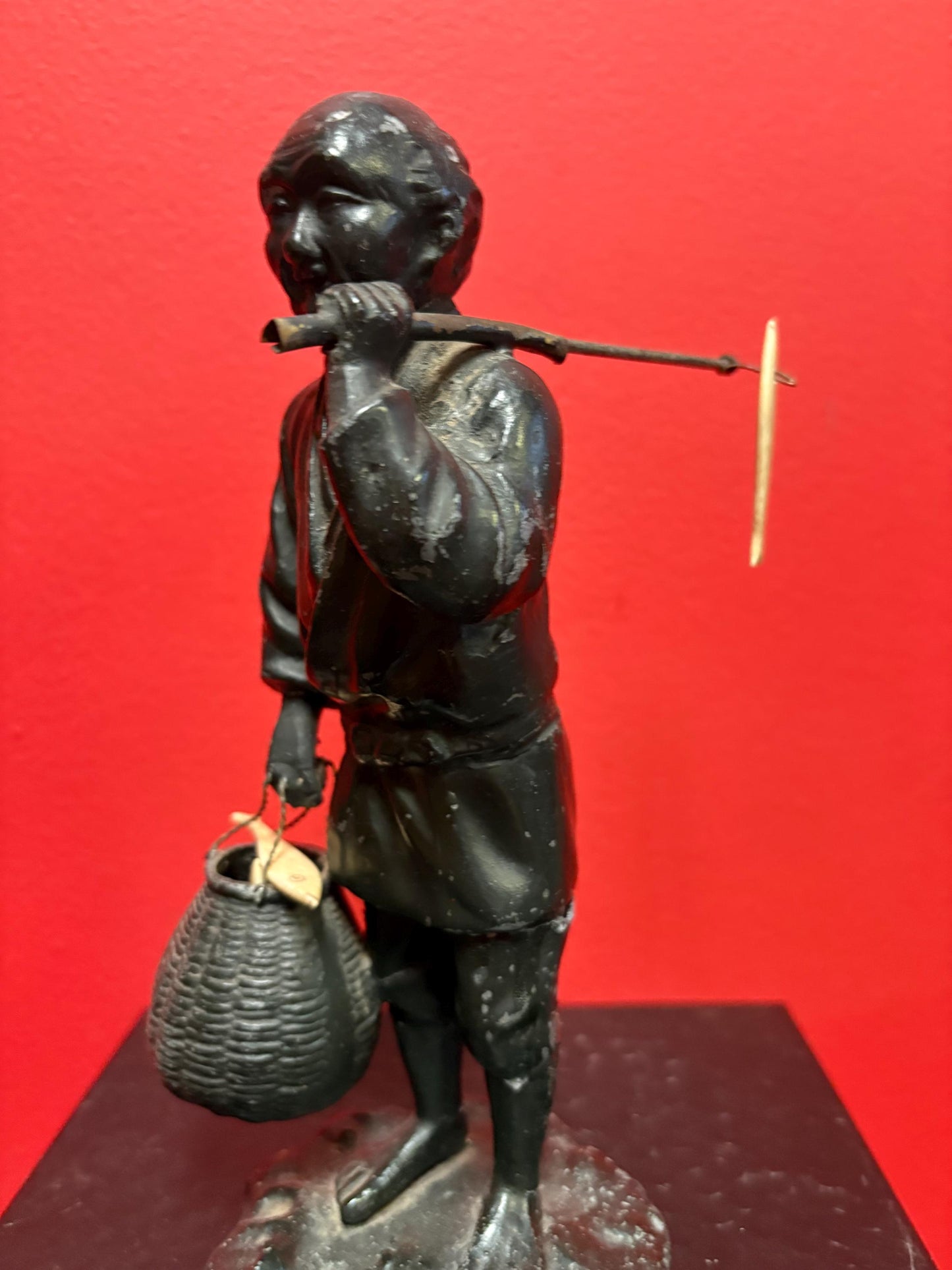Antique Japanese bronze fisherman with bone fish  8.5 inches tall  see photos  lovely piece  great gift