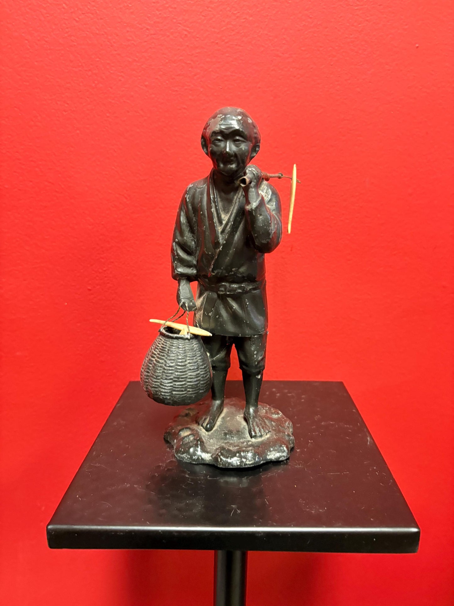 Antique Japanese bronze fisherman with bone fish  8.5 inches tall  see photos  lovely piece  great gift