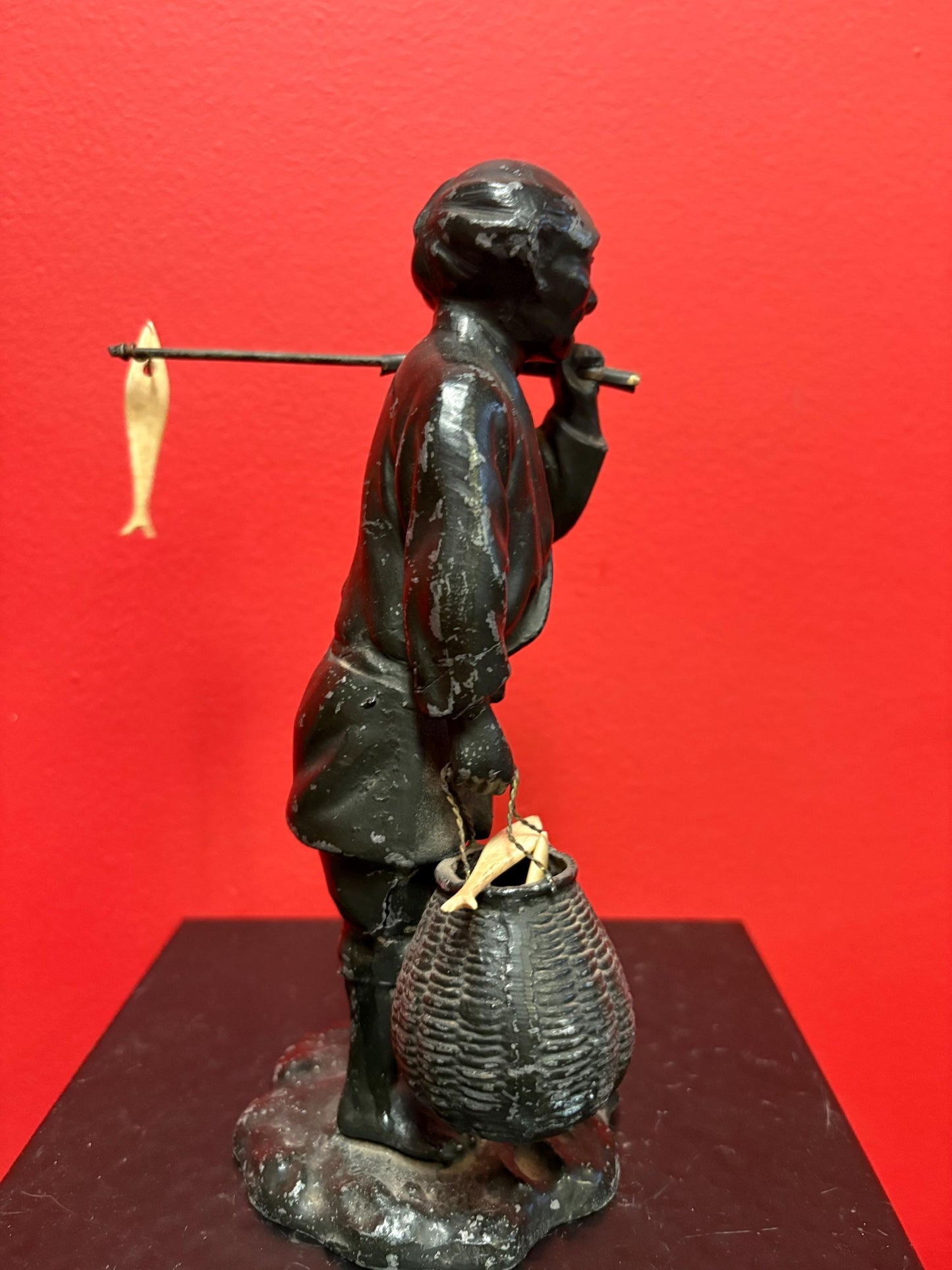 Antique Japanese bronze fisherman with bone fish  8.5 inches tall  see photos  lovely piece  great gift