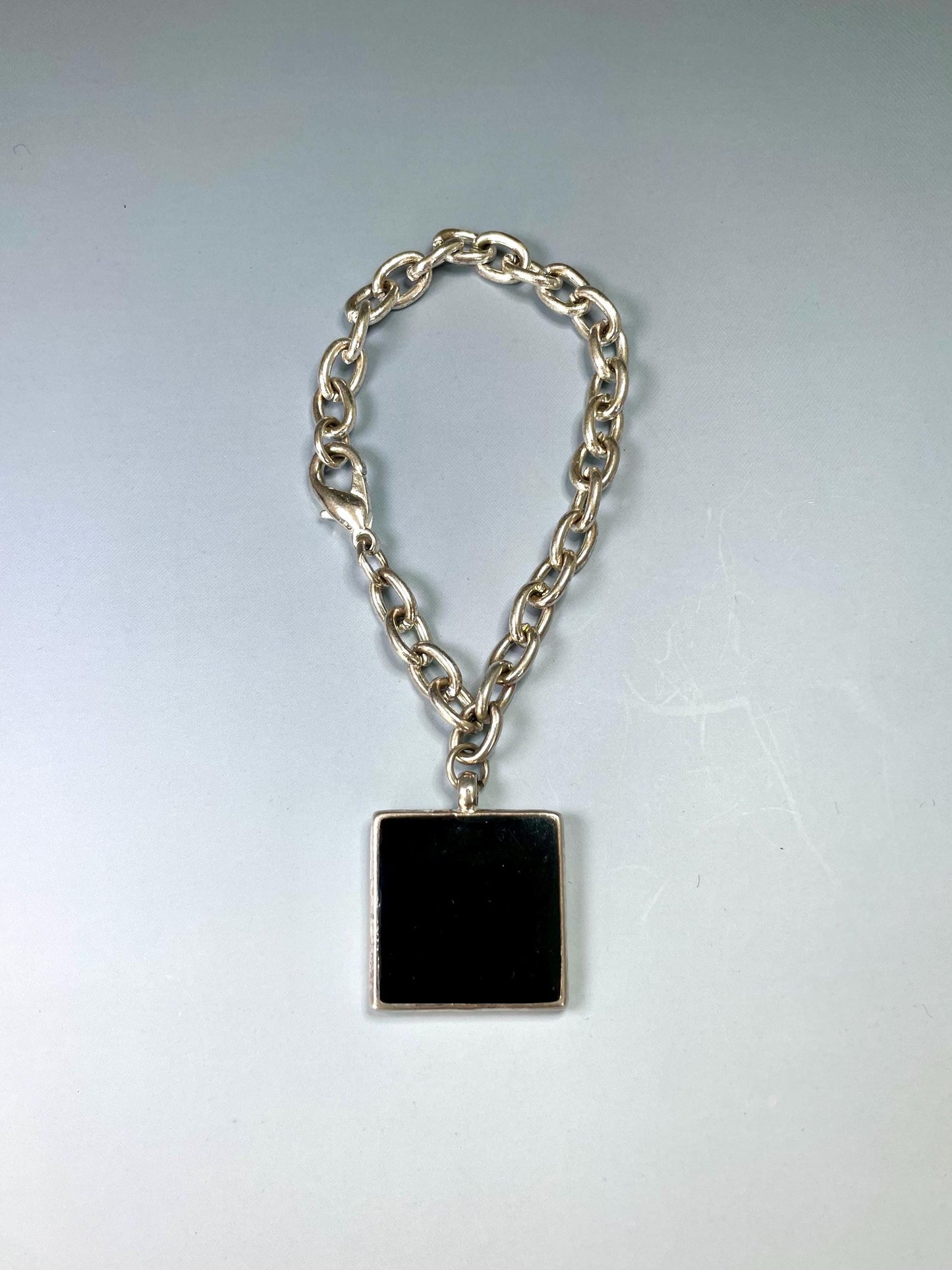 Classic Metal Link Bracelet with Large Black and Green Gem  Timeless and Versatile