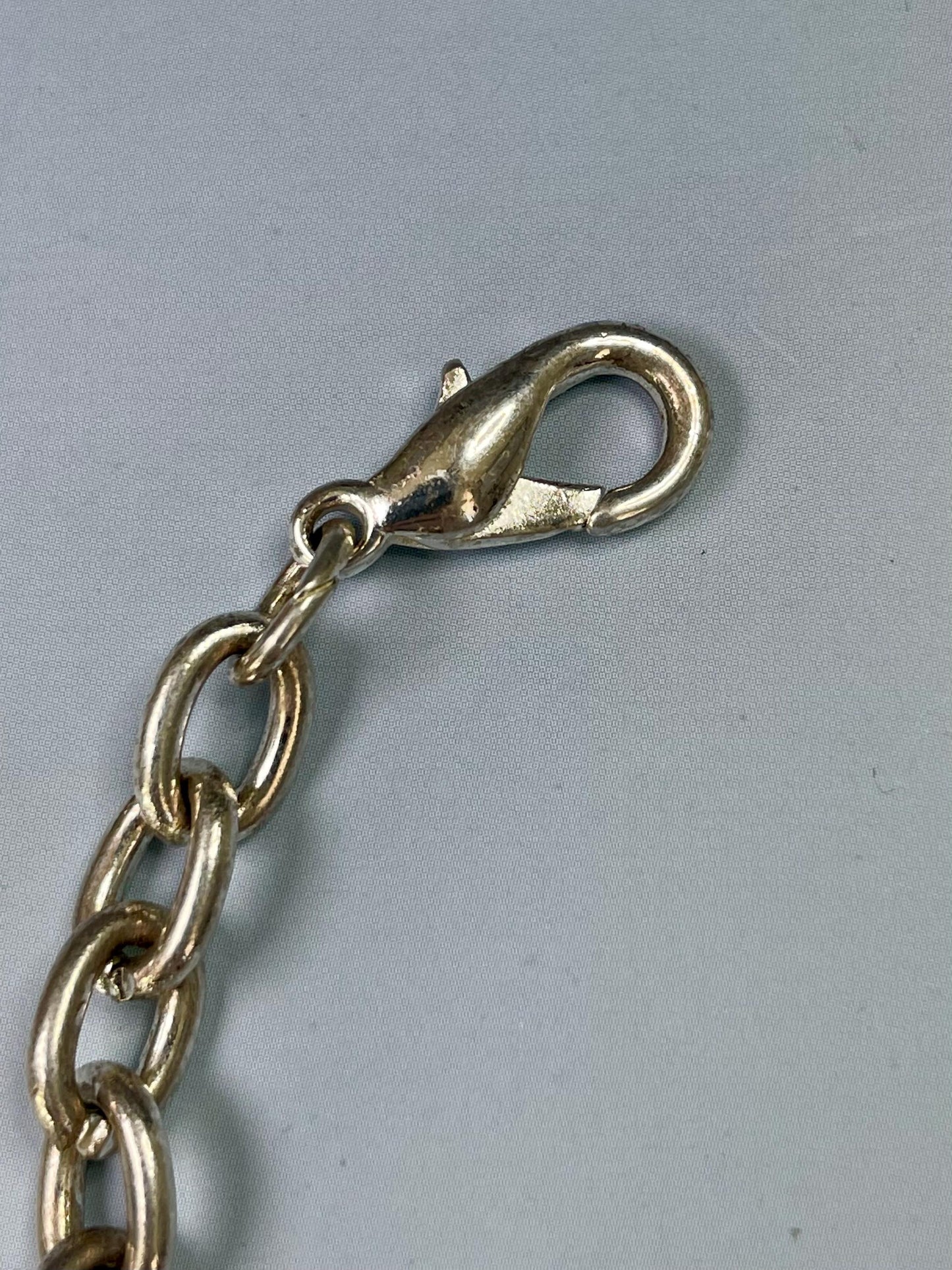 Classic Metal Link Bracelet with Large Black and Green Gem  Timeless and Versatile