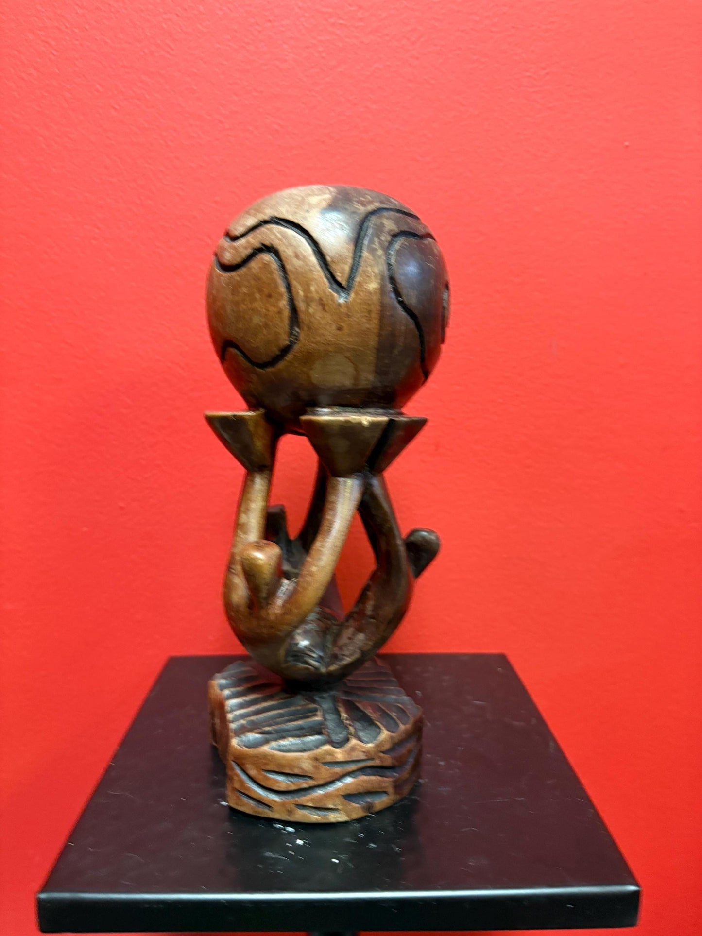 Lovely vintage African wooden statue of people holding up the world  9 inches tall  peaceful art sculpture