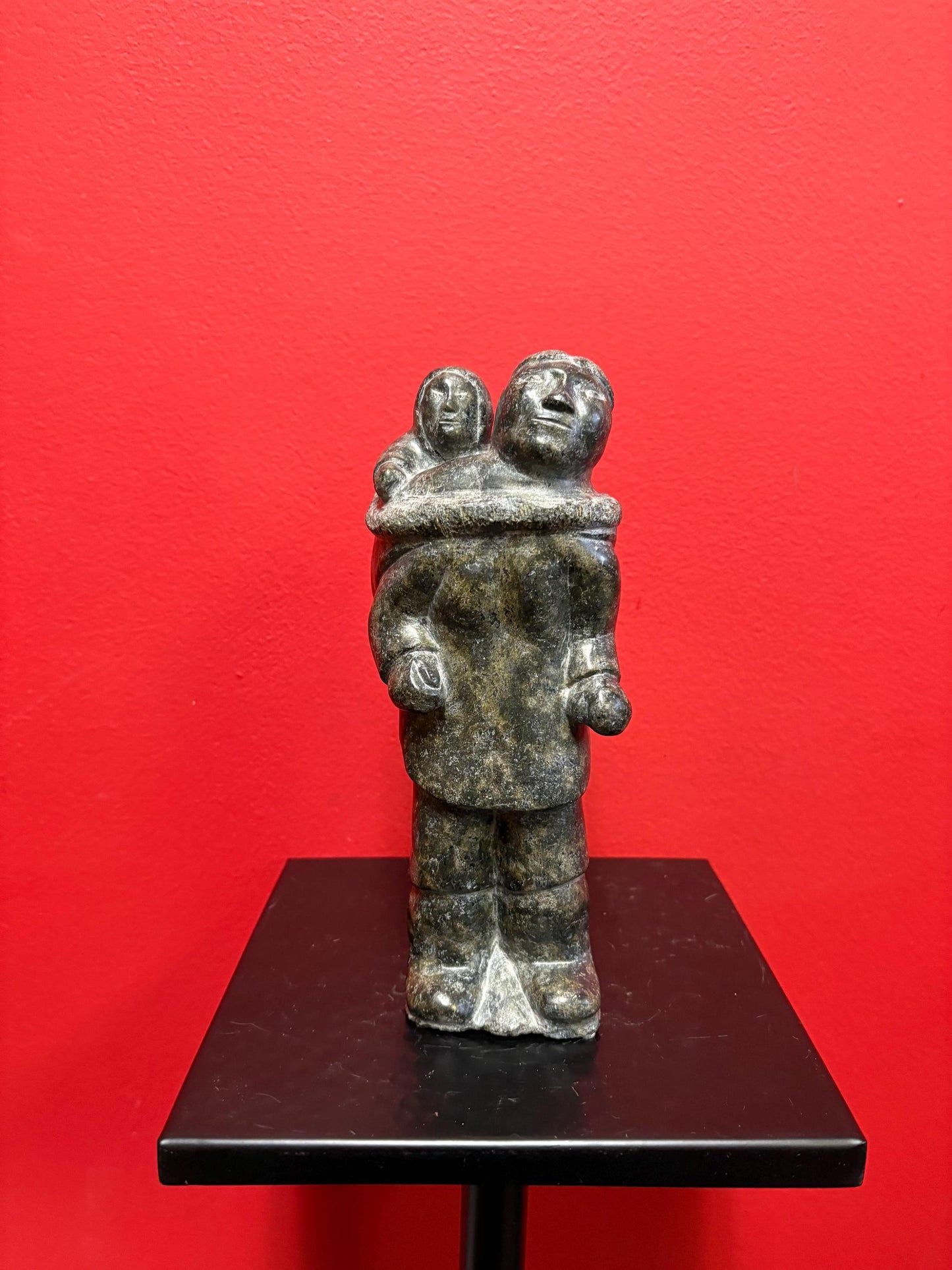 Fabulous signed indigenous Inuit  soapstone statue of a man and child   9 inches tall  great condition and detail  Inuit art