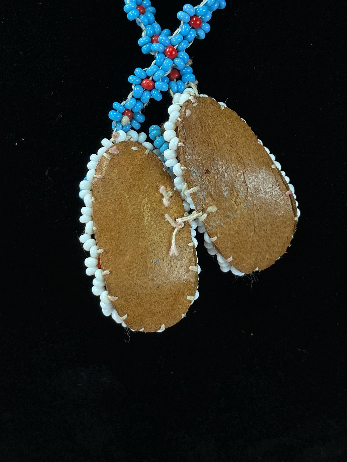 Beautiful approximately 22 inch long, indigenous first nations pacific northwest coast beaded necklace with tiny moccasins  great condition