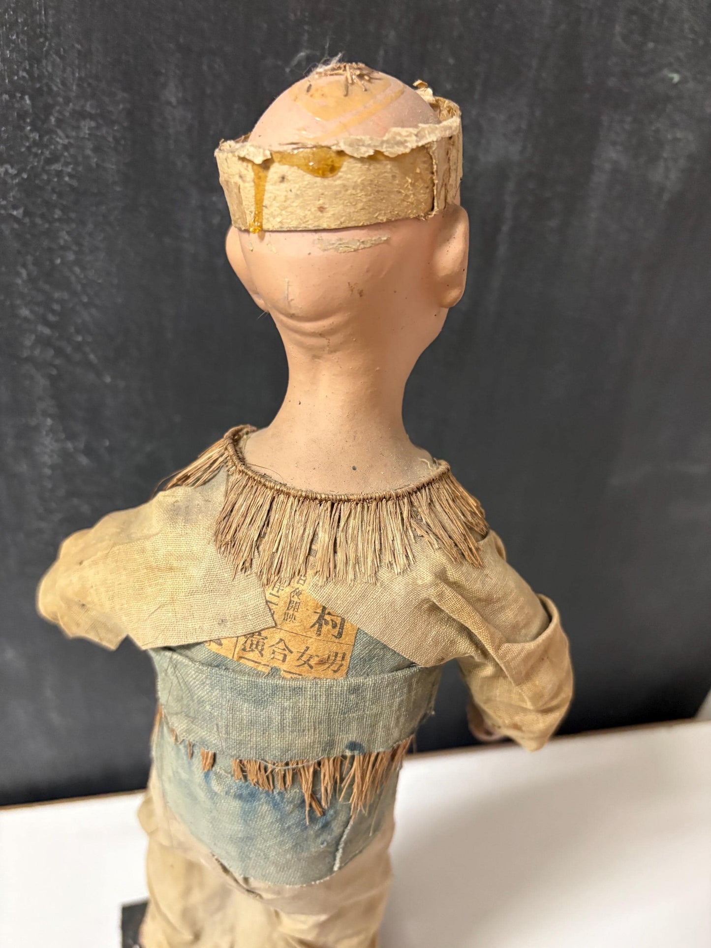 Stunning Chinese  18th century porcelain newspaper, straw and cloth statue of a man on wood stand  wow - 15 inches tall