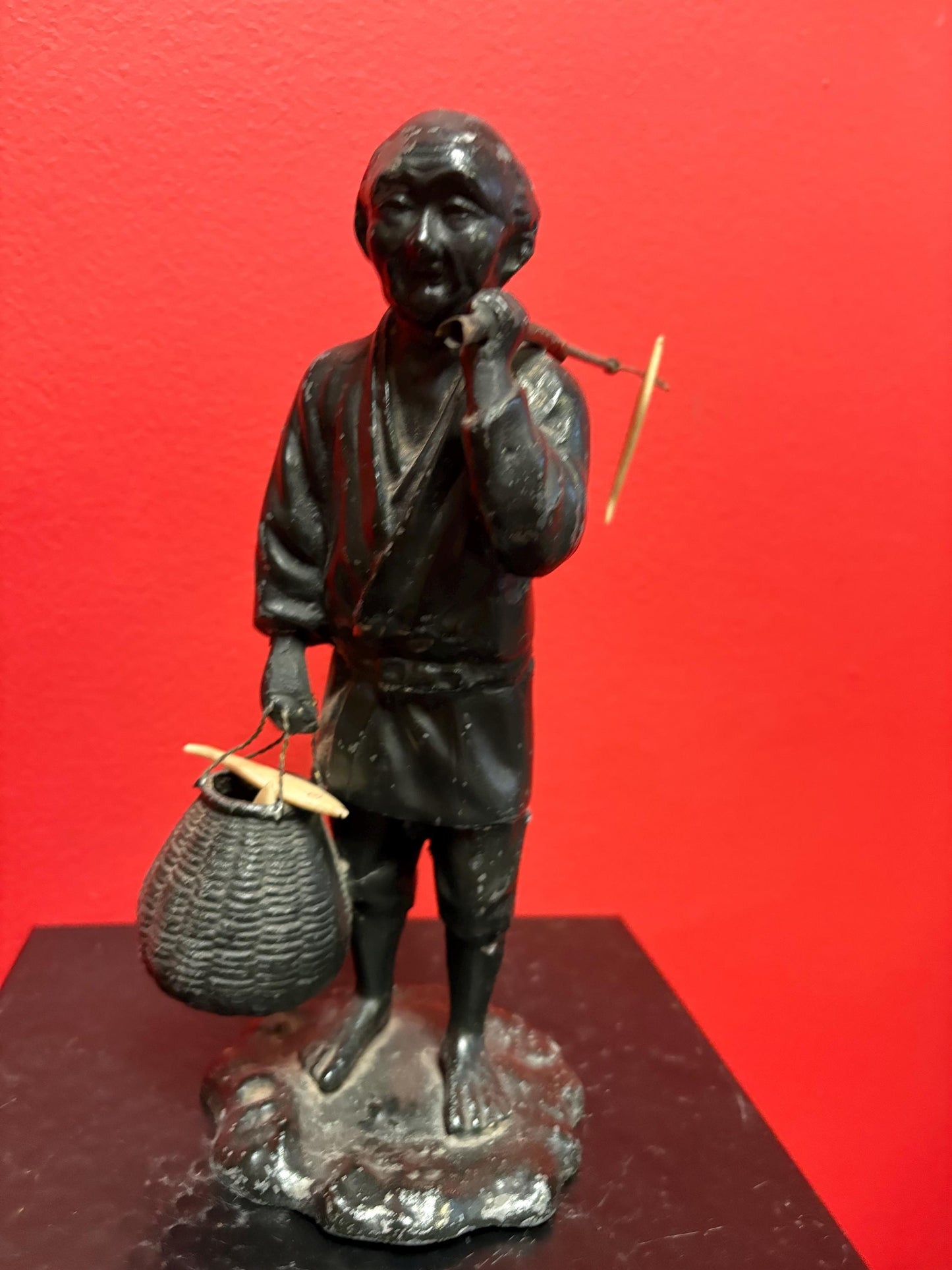 Antique Japanese bronze fisherman with bone fish  8.5 inches tall  see photos  lovely piece  great gift