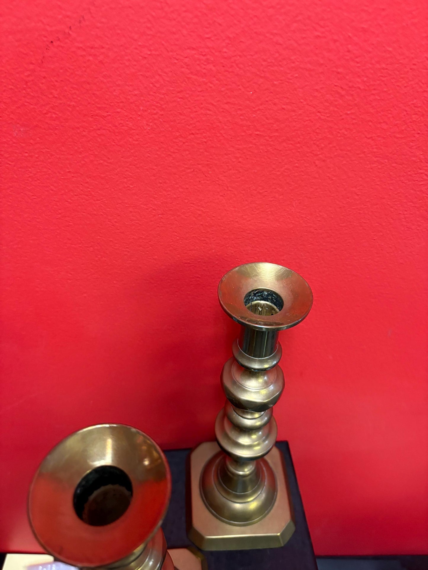 Beautiful 11 inch tall antique brass candlesticks with the original lifters  good condition and stable