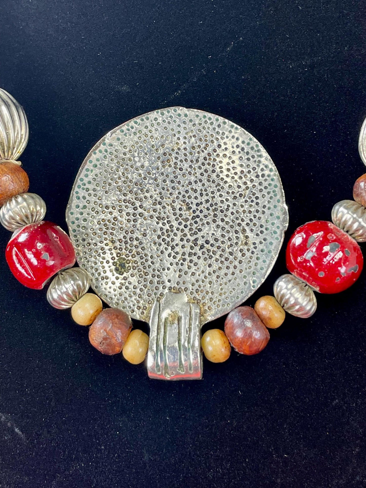 Lovely Beaded necklace  approximately 22 inches long  2.25 inch Metal Pendant