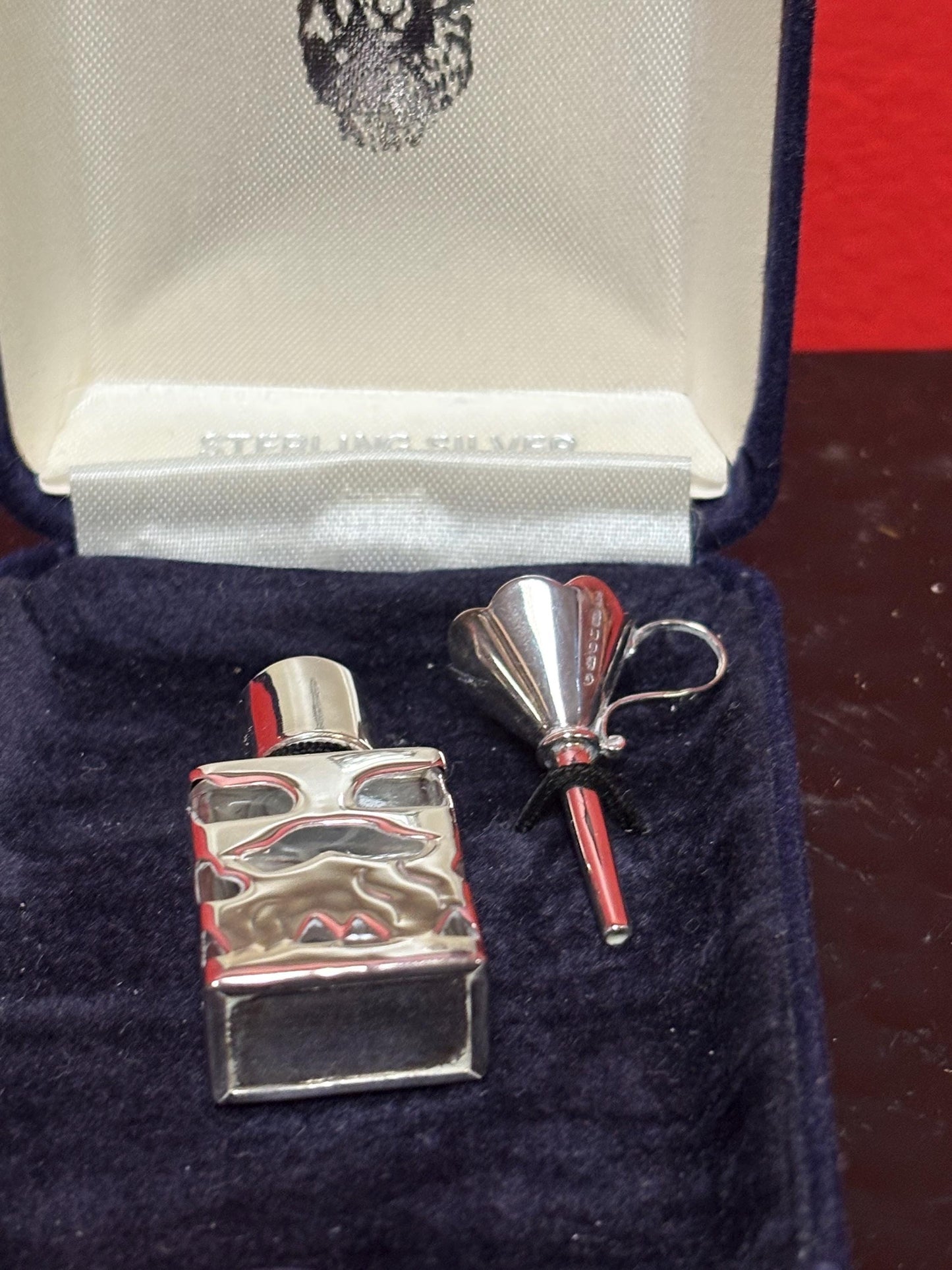 Lovely Sterling silver miniature perfume bottle with funnel in original box in perfect condition  great gift